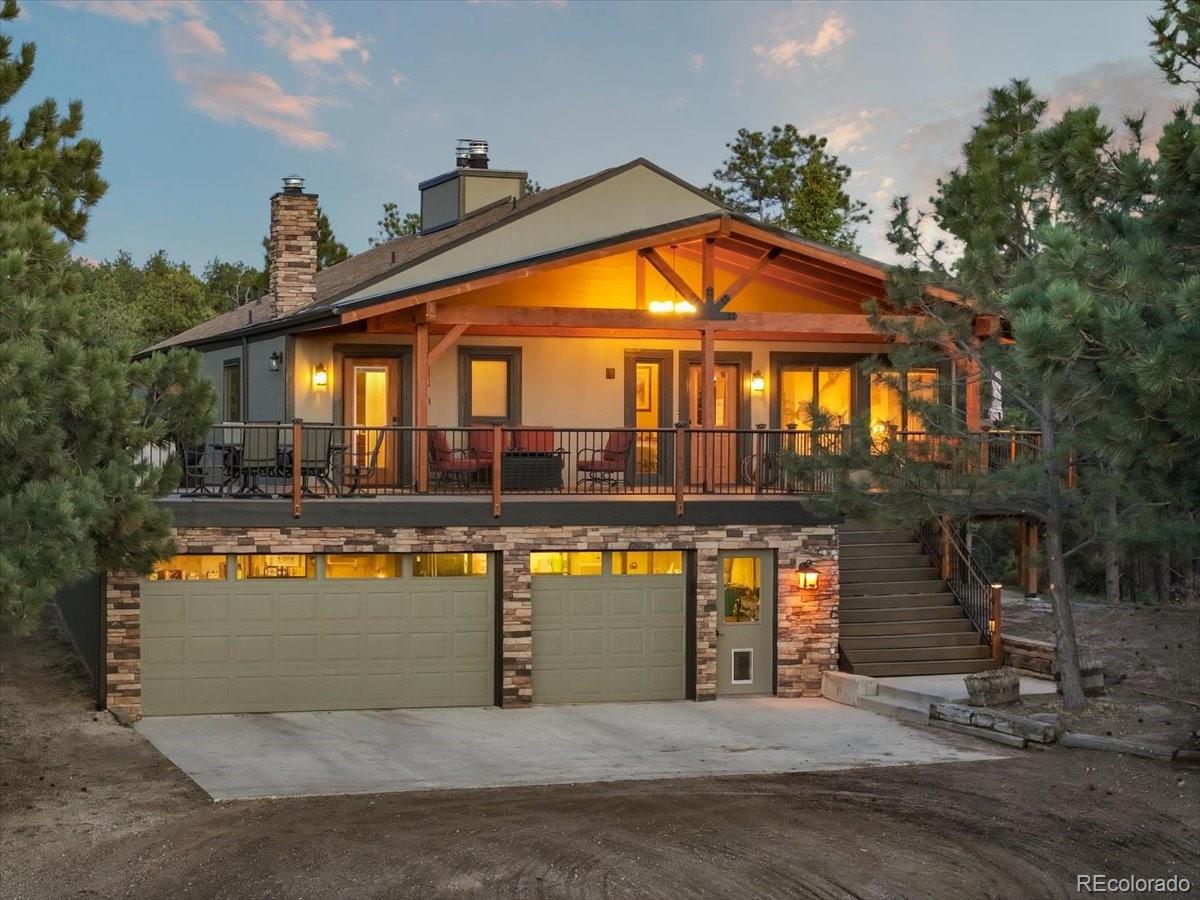 There is literally nothing else like it. One of a kind. Rare. Extraordinary. Pick your favorite words to describe this STUNNING renovated, secluded mountain lodge on almost 10 forested acres in the heart of Monument. Beamed tongue-and-groove ceilings, a newer composite deck and roof, and views all around of Pikes Peak, the Front Range, the Palmer Lake Star and the Ponderosa Pine forest, AND a 50'x36' heated RV garage with adjacent level parking pad, all ready for your ultimate Colorado lifestyle. Completely isolated and private and NO HOA. Tinker with your RV and your toys in the garage, grow a garden, have all the farm animals you're dreaming of or just enjoy the peace and quiet. You'll have all the advantages of "city life" - close enough schools, shopping, and major traffic corridors, with all the advantages of the country life. You'll feel like you're in the middle of nowhere while being close to it all. Seriously - few people even know the house is back there, that's how tucked away and remote it is. This home is it's own subdivision, close to Woodmoor, but not part of the HOA so none of the covenants and conditions apply for ultimate freedom in how you choose to enjoy this property. You'll be surrounded by local wildlife such as elk, deer and wild turkeys, who still consider this quiet retreat their home as well. Forest breezes and passive solar windows keep the home cool in the summer, and the main-floor wood-burning fireplace and lower-level woodstove keep it warm in the winter, pumping out so much warmth you may find limited need to turn on the gas baseboard heating system. Please see the attached list of all the improvements and upgrades this home has received in the past few years. There's more than we can list here! Most importantly, this property has been a beloved, peaceful retreat - carefully maintained and respectfully upgraded to keep its' heritage intact and it's charm at the forefront. D-38 schools, close to I-25/Hwy 105/Hwy 83.