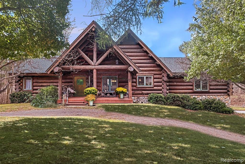 SELLER MOTIVATED, with a NEW PRICE adjustment that has been done to reflect the homes need for a little TLC.  The seller has some of the needed product and supplies available.  This custom-built log home in the woods with acreage and waterfrontage is a must see!  A hunters delight with an abundance of wildlife can be found on this beautiful 39+ acre wooded property.  (Additional 10+ acres available).  16" in diameter harvested logs were used to construct this incredible home with 4 bedrooms (2nd bedroom is currently used as an office/den), 2 1/2 bathrooms, finished walk-out basement and daylight windows.  From the custom-made wood entry door to the Amish Birdseye Maple cabinetry this home is a one-of-a-kind gem.  Large country kitchen with Butcherblock island and walk-in pantry.  In the great room, windows present spectacular views of the exterior property and the 20-acre spring fed pond with island, plus the vaulted ceiling beautifully showcases the River Rock Stone on the natural wood burning fireplace with wrap around log mantel.  With wood flooring, a jacuzzi tub, on-demand hot water, 2 furnaces and 2 central air conditioners, everything has been thoughtfully designed.  There is an additional 4-car detached 1-1/2 story log garage w/electric and a separate potting shed on the property.  Why drive 4 hours to hunt UpNorth, when you can do it all and live in this fabulous private oasis, yet close to all the wonderful amenities that lovely Lapeer has to offer!