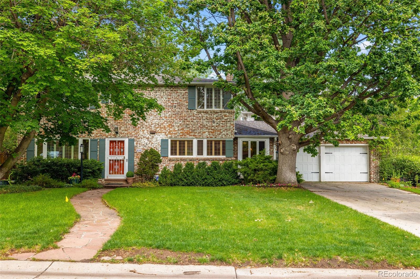 Set on an expansive 11,700 square foot lot in the heart of Old Crestmoor, this attractive brick home has endless possibilities. Designed for comfortable living, the floor plan flows gracefully from the moment you step inside, including hardwood floors, coved ceilings, and plantation shutters. The entry foyer leads to a large, sun-drenched living room accented by a handsome fireplace, while the formal dining room opens to a well-equipped kitchen and breakfast room. French doors off the dining room lead to a large patio and private backyard, and the vaulted family room—with built-in shelving and a media center—provides additional outdoor access. The main level also includes a laundry room and powder room. Three bedrooms are located upstairs, including a private primary suite featuring a fireplace, walk-in closet and 4-piece bath. The lower level is highlighted by a huge rec room with fireplace and bar area, along with a study/possible 4th bedroom, full bath, and abundant storage. With exceptional character and generous gathering spaces, this incredible residence is perfect for indoor/outdoor Colorado living.
