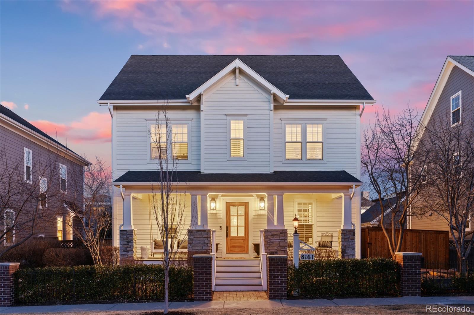 This light-filled residence, defined by timeless curb appeal, elegant architecture, and contemporary updates, is ideally positioned directly on a rare pocket park just three blocks from Central Park and offers the perfect combination of an incredible location, gorgeous updates, and highly functional living. The main level features a beautiful open kitchen space with two islands, granite countertops, counter seating, stainless steel appliances, a walk-in pantry, hickory floors, windows in nearly every direction, a casual living room with a gas fireplace, a formal dining area, access to the rear patio and yard, and a mud room between the living area and the oversized attached garage. Near the front of the house, the beautifully appointed main level formal living room and home office each offer views of the park, and a powder room completes the main level. Upstairs, the spacious primary suite includes a private south-facing balcony, a generous walk-in closet, and a 5-piece en suite bathroom. A second upstairs bedroom features a full en suite bathroom, two additional bedrooms are adjoined by another full bathroom, and the laundry room is also conveniently located upstairs. The spectacular basement is one of the only ones in the neighborhood with soaring ~10 foot ceilings, heated floors, a fantastic wet bar, a large flex space, an additional living room, two additional conforming bedrooms (one currently used as a fitness room), another full bathroom, mechanicals, and storage. The rear yard extends the living space outside with a paver patio, a grass area, and a second paved patio with a pergola for extra privacy. In the front, you'll love having a covered porch, raised garden beds, and a pocket park right outside your front door! Phenomenal location just three blocks from Central Park and FlyteCo, and ~1/2 mile to the Central Park commuter rail station with easy access to downtown Denver and DIA. Schedule your private showing today! Buyer to verify all information.