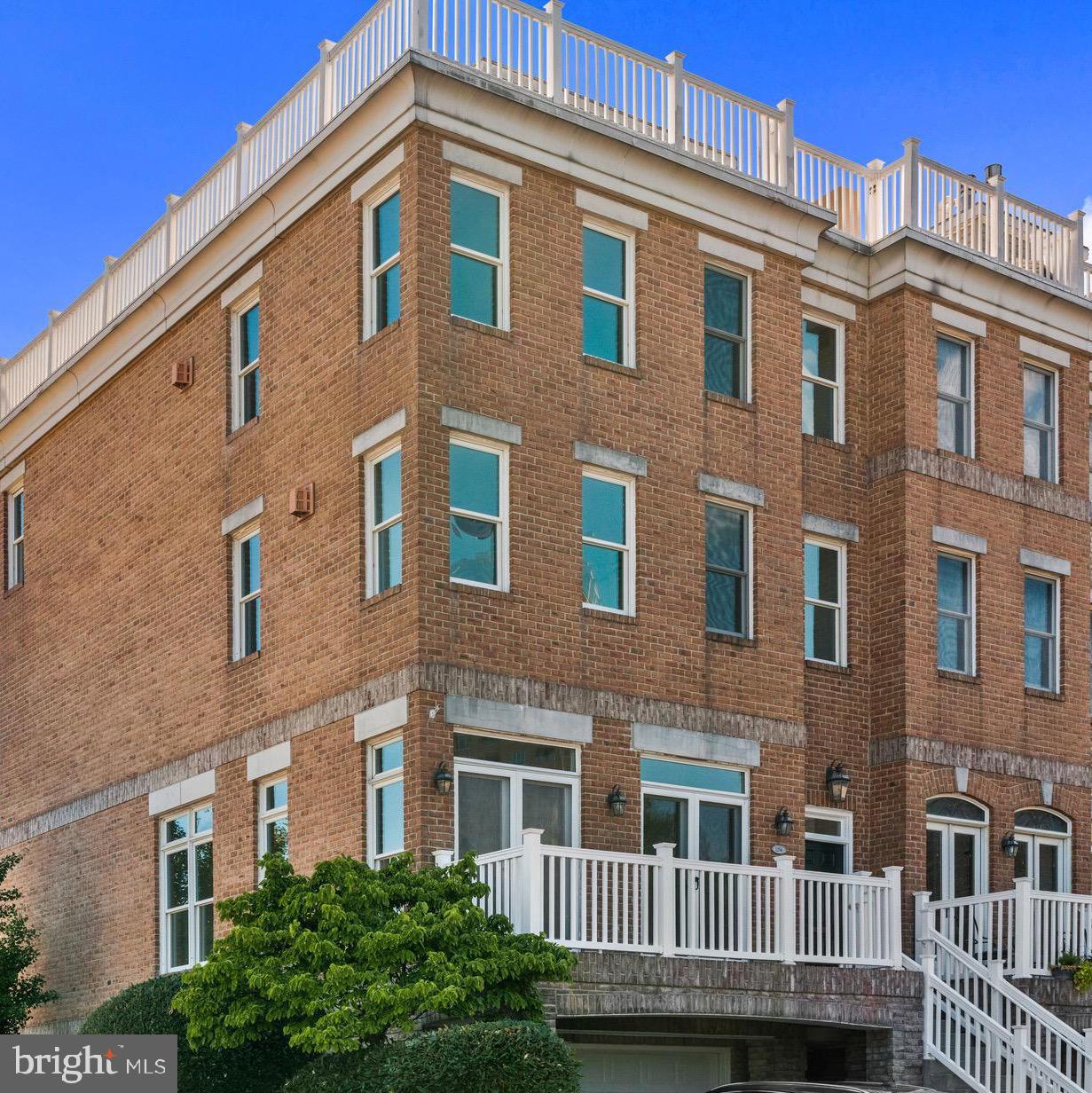 Nestled in a vibrant community, this exquisite end-of-row townhouse offers a luxurious lifestyle defined by stunning views and exceptional amenities. With 3,600 square feet of thoughtfully designed living space, this residence is a perfect blend of elegance and comfort, inviting you to experience the best of upscale living. As you step inside, the warmth of hardwood flooring greets you, leading you through an open layout that seamlessly connects the living areas.  The well-considered, open floorplan creates an inviting atmosphere for gatherings or quiet evenings spent indoors. The expansive windows frame breathtaking views of the city skyline, harbor, and marina, allowing natural light to flood the space while providing a picturesque backdrop that changes with the seasons. The property boasts a wealth of high-end features, including access to a community pool, fitness center, and on-site bar/lounge/deli perfect for unwinding after a long day. The meticulously maintained common areas reflect a commitment to quality and comfort, ensuring that every moment spent here feels special. Enjoy the convenience of on-site banking and security, adding an extra layer of peace of mind to your daily routine. Step outside to discover the beauty of the surrounding landscape, where scenic vistas and water features create a serene environment. Whether you're sipping your morning coffee on the patio or taking a leisurely stroll along the waterfront, the tranquil ambiance invites relaxation and reflection. Parking is a breeze with an attached garage and driveway, providing ample space for your vehicles and guests. The community's commitment to maintenance ensures that you can spend more time enjoying your home and less time worrying about upkeep. This property is not just a home; it's a lifestyle. With its prime location and luxurious amenities, you'll find yourself immersed in a world of comfort and sophistication. Experience the perfect blend of city living and serene waterfront views, where every day feels like a getaway. Embrace the opportunity to make this stunning townhouse your own and enjoy the exclusive lifestyle it offers.