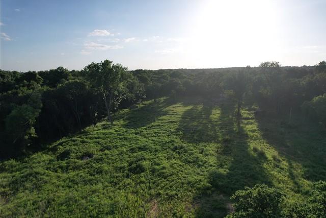 Discover a stunning 11+ acre parcel near Lake Thunderbird, perfect for building your dream home or creating a private retreat. This property offers a unique combination of privacy, natural beauty, and modern conveniences. The lot backs up to public land, ensuring no immediate neighbors and an extra level of seclusion. This land provides peace of mind and security for your investment. High-speed internet and electricity are available at the street, providing modern connectivity in a serene, rural setting. The versatile terrain features a cleared front area, ideal for a house pad, while the mature trees towards the back offer opportunities for livestock, trails, or recreational use. Additionally, a charming creek runs along the south side of the property, enhancing its natural appeal. Located close to Lake Thunderbird, this land offers easy access to boating, fishing, and other outdoor activities. While it maintains a tranquil, rural atmosphere, it also provides convenient access to major roads and amenities. This is a rare opportunity to secure a large, versatile piece of land in a desirable location. Whether you envision a custom-built home, a hobby farm, or a peaceful getaway, this property provides the ideal foundation. ALL PAVED ROADS 1,200 sq ft min on size of home. Exterior of home must be 20% brick, stucco, metal or stone. Outside of city limits. Tract 3 on Covenants