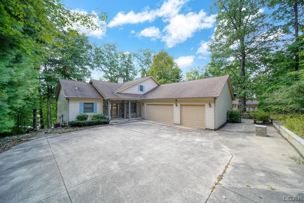 *PLEASE DO NOT APPROACH PROPERTY WITHOUT A SCHEDULED APPOINTMENT.* Spacious lake front home offering 4,000 sq. ft of living space! With views of the gorgeous all-sports lake Loch Erin out every window! Featuring 4-bedrooms, home office, sunroom, finished basement, walk-out, dry bar and more! The garage is a MUST SEE, with the ability to fit 6 cars, and a workshop. It comes equipped with skylights, furnace, 100amp panel, and generator! Dont wait, schedule your tour today!