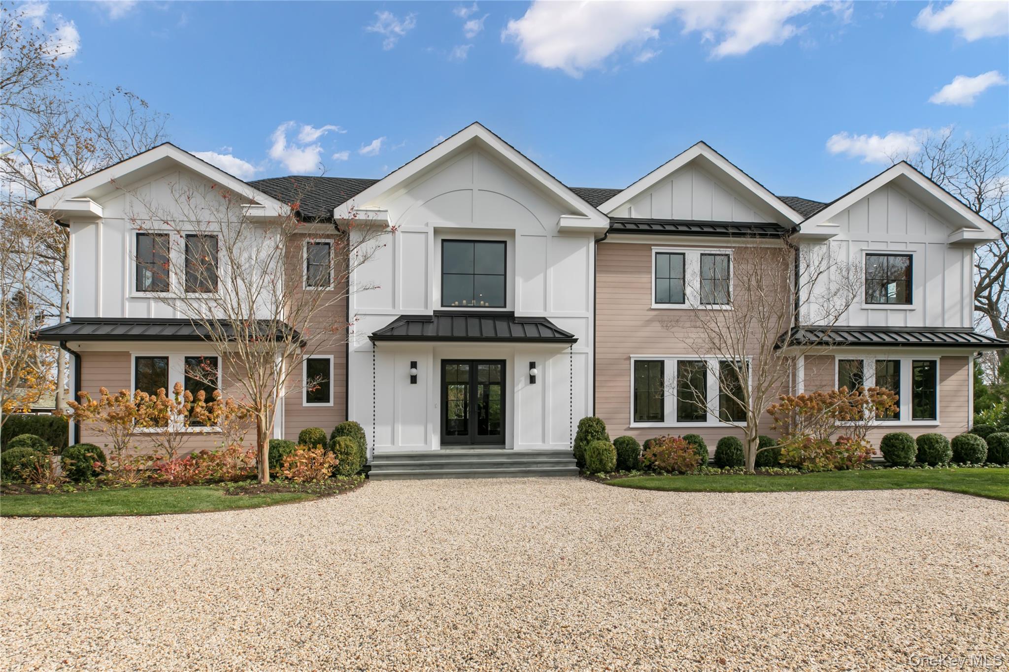 New Construction | Water Mill SouthJust completed by boutique custom builder Heartwood Corp, this 7-bedroom, 9-bathroom, 9,600-square-foot Water Mill South estate showcases signature craftsmanship and refined detail. Positioned on prestigious Cobb Road behind a motorized gate and enveloped by mature, professionally designed landscaping, the property offers a private retreat moments from Flying Point Beach and Southampton Village.A soaring two-story foyer introduces the open, light-filled layout, highlighted by architectural floor-to-ceiling millwork on a double-sided gas fireplace shared with the living room. The dining area flows into a fully outfitted butler’s pantry with sink, ice maker, wine refrigerator, and walk-in pantry.The chef’s kitchen blends elegance and performance with custom white oak and painted cabinetry, integrated luxury appliances, and a hybrid waterfall island ideal for entertaining.The first-floor junior suite features a private patio, two walk-in closets, and a large spa-inspired bath with double vanity and privacy-glass shower enclosure that welcomes natural light. The living room, kitchen, foyer, and junior suite all overlook the landscaped grounds and pool, creating seamless indoor-outdoor living. A mudroom with garage access and a powder room complete the main level.Upstairs, the primary suite is a tranquil sanctuary offering two walk-in closets, a luxurious bath with soaking tub, separate vanities, makeup station, and privacy-glass shower and water closet, plus a dedicated office and serene views. Four additional ensuite bedrooms, a bonus room, and a custom-outfitted laundry room complete the second floor.The lower level is designed for recreation, featuring a glass-enclosed wine cellar, den with wet bar and wine cooler, flexible gym/media/game space with exterior access, a private sauna with Bluetooth controls, a full bath with steam shower, powder room, and two guest or staff bedrooms.Outdoors, resort-style amenities include a heated saltwater Gunite pool with integrated spa and sundeck, outdoor shower, stainless-steel kitchen and bar, and a dedicated outdoor powder room for poolside convenience. Expansive patios and lush landscaping set the atmosphere for effortless summer living.With Wi-Fi–enabled smart-home capabilities, custom cabinetry, tailored closet systems, central vacuum, laundry on two levels, and a radiant-heated two-car garage, 158 Cobb Road embodies timeless sophistication, abundant natural light, and modern Hamptons craftsmanship.