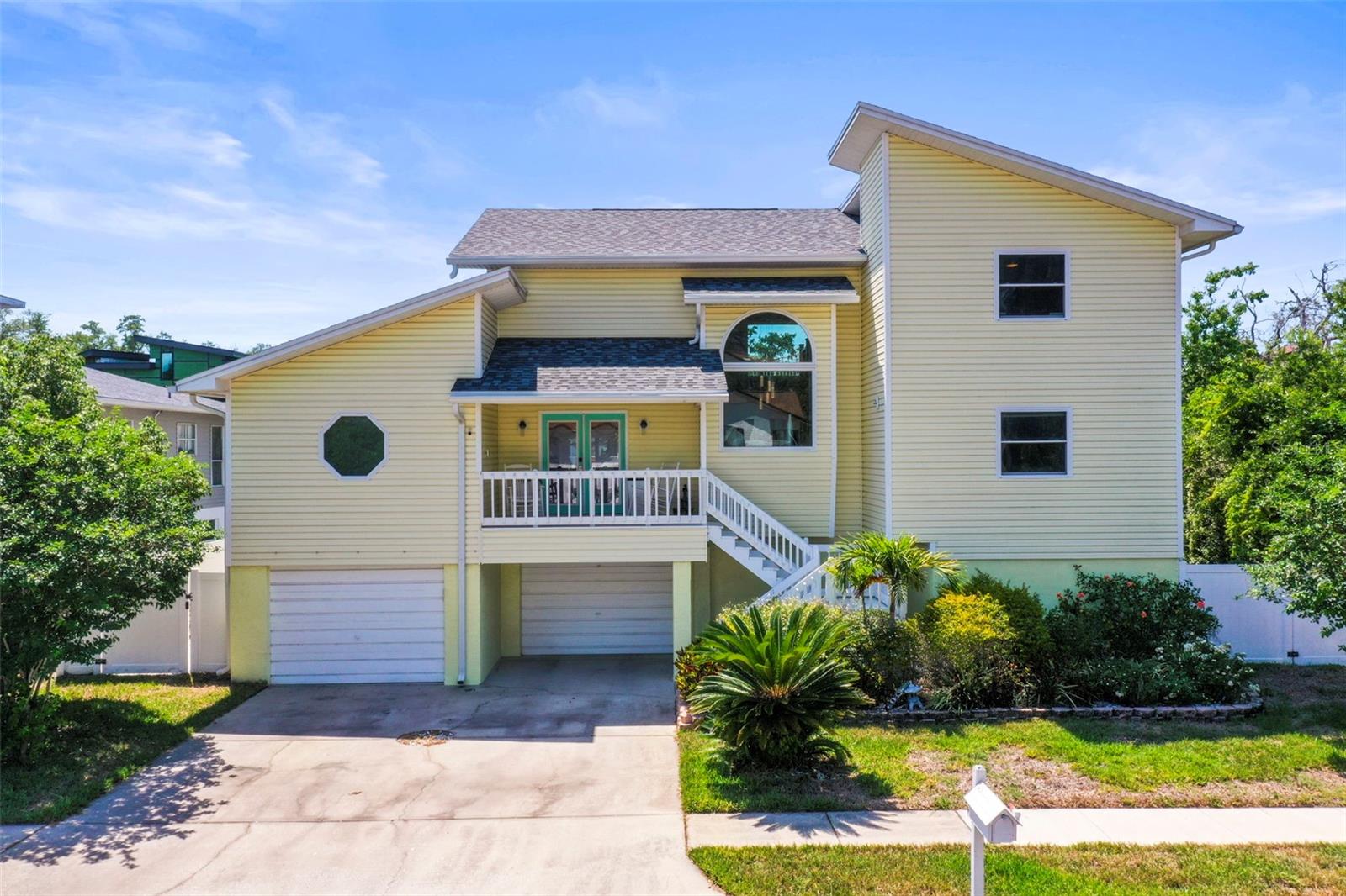 Welcome to your waterfront retreat in Palm Harbor! Experience the best of Florida living with this gulf-access waterfront home, perfectly situated on a canal with direct access to the Klosterman Bayou, St. Joseph Sound and the stunning barrier islands of Honeymoon Island, Three Rooker Island, and Anclote Key. Whether you enjoy boating, fishing, or simply soaking in coastal views, this property delivers. This home has been thoughtfully updated, offering peace of mind and modern comfort with major improvements including two new Carrier HVAC systems (2024), a composite dock with boat lift (2022), new shingle roof (2019), updated kitchen appliances (2022), new seawall (2020), exterior vinyl siding (2020) and impact-rated windows, sliders, and doors (2019)! The first level features an oversized two-car garage with ample storage and a versatile finished flex space, ideal for a home gym, workshop, or bonus room. On the main living level, you’ll find an open and airy layout highlighted by vaulted ceilings, cozy woodburning fireplace, two covered balconies, two full bathrooms, and a spacious primary suite complete with an en-suite washer and dryer for added convenience. The spacious kitchen and dining room combination overlook the west facing water views and abundant wildlife including waterbirds, manatee and dolphin. Terra cotta style floors, white cabinets and stainless-steel appliances all nod toward the breezy, casual Florida lifestyle. A unique half-spiral staircase makes a statement and leads to the top floor, where a den or office space awaits, along with an additional bedroom, full bathroom, and a third private balcony perfect for enjoying peaceful water views or sunset skies. This is more than a home; it’s a lifestyle opportunity in one of Florida’s most desirable waterfront communities. Schedule your private showing today and discover the true value of coastal living!