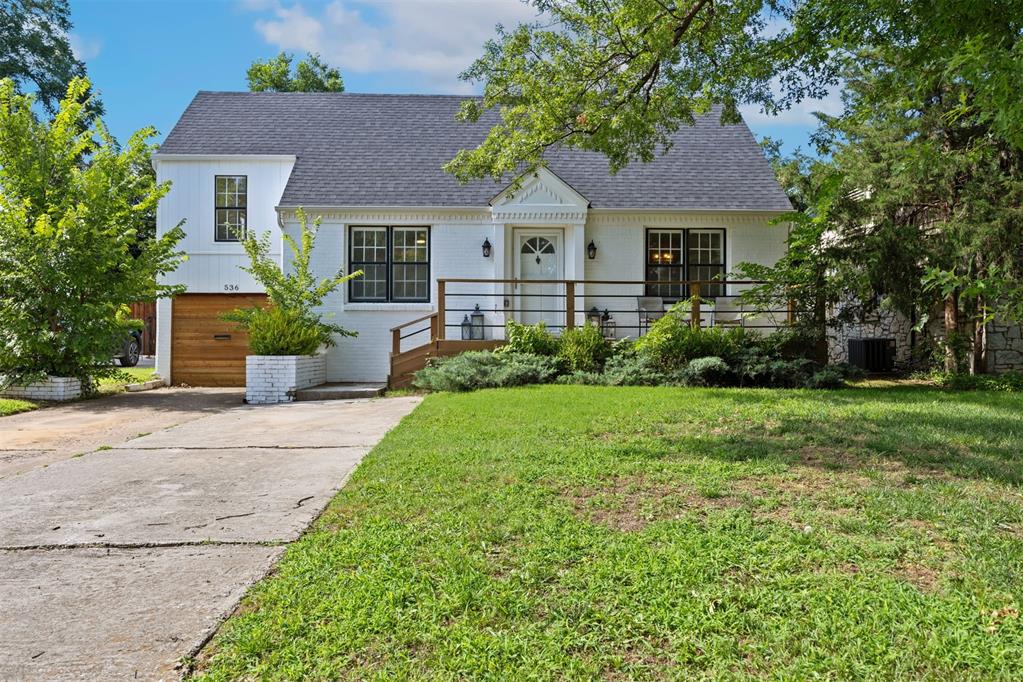 This beautifully updated traditional bungalow in the sought-after Douglas Place neighborhood sits around the corner from the green spaces and walking trails of Douglas Park. Inviting front porch with wood railing lead you into this light-filled 3 bedroom, 2 bathroom home. The open living and dining area have large picture windows and warm hardwood flooring that offer a bright and flexible space for everyday living and entertaining. The remodeled kitchen features a striking blend of modern and classic elements with dark shaker style cabinetry, quartz countertops, stainless steel appliances and a bold geometric backsplash. A charming exposed brick column from the original chimney flue adds character and warmth. The bedrooms are generously sized with updated ceiling fans and hardwood flooring. A third bedroom off the hallway with separate entrance and large closet offers potential as a guest space, office or bonus bedroom. The renovated full bath features designer floor tile, marble top vanity with modern lighting and hardware and a large tub/shower combo with subway tile surround and built-in niche. There is a spacious walk-in closet area filled with natural light, custom shelving and a stylish barn door entry. The large laundry/mudroom is the converted garage and includes ample storage and updated flooring for added functionality. The backyard includes a covered pergola patio, storage she and mature trees creating the perfect setting for outdoor entertaining, relaxing or gardening. Throughout the home new light fixtures and neutral interior paint create a cohesive, move-in ready space. With quick access to 1-235 and just minutes from the vibrant Western Avenue District, Nichols Hills and Downtown OKC, this home combines convenience with timeless appeal.
