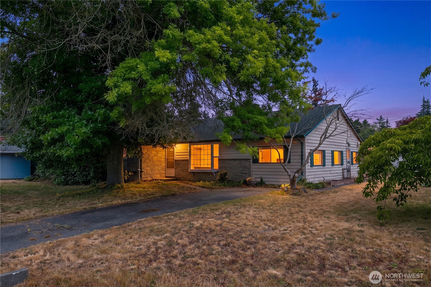 Welcome to Edmonds! Full of character and opportunity, this 4-bedroom, 2-bath home offers 1,867 square feet of versatile living space on a spacious 8,276-square-foot corner lot. Tucked away on a quiet dead-end street, the property provides a peaceful setting with minimal traffic and plenty of room to garden, entertain, or simply enjoy the outdoors beneath the shade of a beautiful mature oak tree. Plenty of parking with two deep driveways. Thoughtful updates over the years include a spacious fourth bedroom or studio featuring vaulted ceilings, while the converted garage adds flexible living space and still includes a dedicated workshop. New flooring in the living room and two bedrooms gives the interior a fresh, updated feel, and the attic offers abundant storage. Ideally located near Edmonds-Woodway High School, this home is just minutes from downtown Edmonds, the waterfront, ferry terminal, and local shops and restaurants. Convenient access to Highway 99 and I-5 makes commuting simple while keeping all that Edmonds has to offer within easy reach.