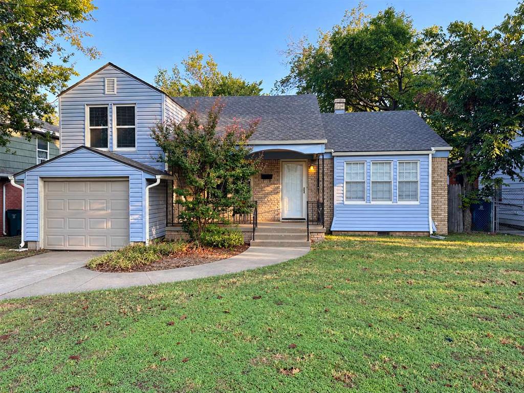 Welcome to this charming home filled with character and modern touches! Featuring beautiful hardwood floors throughout much of the home, spacious living areas, and plenty of natural light. The inviting living room offers built-in shelving and cabinets, while a second living area features a beautiful fireplace, perfect for relaxing or entertaining. The kitchen boasts granite countertops, gray cabinetry, stainless steel appliances, and a stylish tile backsplash. Enjoy updated bathrooms featuring beautiful tile work, a spacious walk-in shower, and double vanities. A separate laundry room provides additional cabinet and counter space, while the upstairs bonus room offers endless possibilities for a home office, game room, or additional living space. Outside, enjoy a spacious fenced backyard with mature trees and plenty of room for outdoor activities. Complete with an attached garage, this home offers the perfect blend of charm, comfort, and functionality. Schedule your showing today!