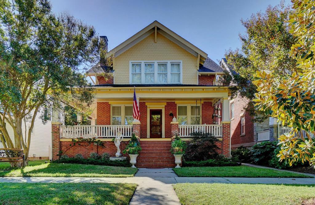 Discover 220 Monroe Ave, a classic brick bungalow in Cape Charles, VA. This three-level home harmonizes vintage charm with modern comfort, featuring original hardwood floors, high ceilings, and a cozy fireplace. The main level boasts a welcoming living room, formal dining room, well equipped kitchen and a convenient half bath. Upstairs, find two full baths and three serene bedrooms, while the lower level houses laundry facilities and a huge bonus rec. room. Enjoy outdoor living with a wraparound porch and two rear patios. Ideal as a primary residence, second home, or investment opportunity, this property is steps from the beach and town central park. Ample storage and parking in the large garage.