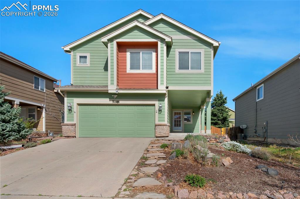 Located on a quiet cul-de-sac, this well-maintained 5-bedroom, 4-bath home offers generous living space and an attached 2-car garage.  Relax on the covered 19 x 9 front porch! Or, step into home and into the living room which features vaulted ceilings, a ceiling fan with light, plush carpeting, and an open view to the loft above. The clean, functional kitchen includes ceramic tile flooring, a pantry with an attractive door, a counter bar with pendant lighting, and a gas range, and the refrigerator stays!. A formal dining area sits just off the living room and also enjoys a vaulted ceiling and stylish light fixture. Natural wood flooring extends into the spacious family room, where a gas fireplace is framed by an arched alcove ideal for a TV and media components, complemented by recessed lighting. The main level also includes a convenient laundry room, and the washer and dryer stay. A patio door leads to the fenced backyard with a relaxing wood deck. Upstairs, the loft overlooks the living and dining rooms and leads to the primary suite plus three additional bedrooms. The 14' x 18' primary bedroom features a vaulted ceiling, ceiling fan, two large windows, a walk-in closet with shelving, and an adjoining 5-piece bath. The other 3 bedrooms are all generously sized, very clean and carpeted. The finished basement provides a 27' x 11' family/entertainment room, a cedar closet with shelving, a nearby bathroom, and a 5th nonconforming bedroom that only needs a closet. Outdoor amenities include a 15' x 14' wood deck, a small gazebo, and an 8' x 10' shed. Conveniently located near Powers Blvd with easy access to shopping, restaurants, and services.