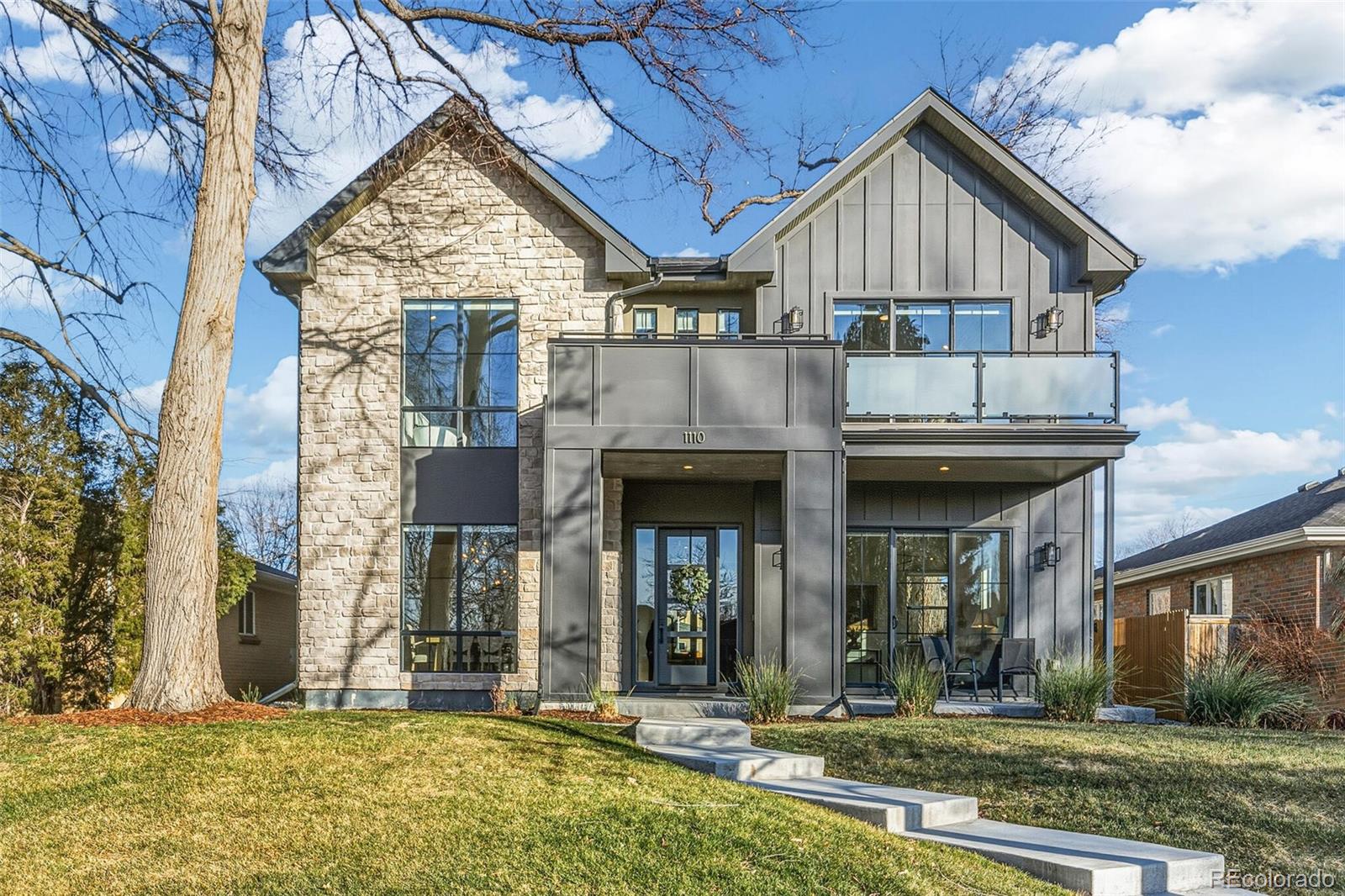 A statement of modern luxury and thoughtful design. This residence offers refined living at every turn. From the moment you enter, a dedicated office and the elegant formal dining room-set a tone of timeless sophistication. The heart of the home, the designer kitchen is a true showcase, featuring a dramatic waterfall island, sleek quartz countertops, a Wolf gas cooktop and an impressive 60" refrigerator. Entertain effortlessly with a discreet butler’s way with abundant storage and an oversized walk-in pantry. Perfectly blending form and function for everyday living.  The expansive family room centers around a striking gas fireplace with a stone surround and opens seamlessly through accordion doors to the covered back patio, creating an ideal indoor-outdoor lifestyle. A gas fireplace in the professionally landscaped yard, fully fenced with a parking pad for guests or caterers. The primary suite is a private retreat, showcasing a two-sided, floor-to-ceiling stone fireplace, a serene seating area, soaring cathedral ceilings with wood paneling. Access to a private deck. The spa-inspired 5- piece bath has a stand- alone soaking tub and a large custom shower with dual showerheads. The experience continues with a generous 12' x 10' walk-in closet and an attached laundry room complete with a utility sink, offering unmatched convenience and luxury. Full finished basement with 9 ft. ceilings, wet bar with double wine fridges. a workout room if desired or additional conforming bedroom. Dual zoned HVAC, tankless water heater. Great location, close to Wash Park, Gaylord Street and Cherry Creek. This is luxury living at its finest.
