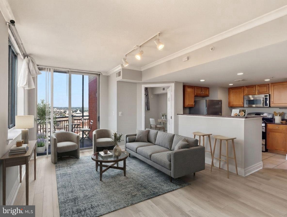 Ready for Move-In!  Newly renovated 2 bedroom unit in the Inner Harbor area!  Beautiful driftwood floors and neutral paint make this the best buy in the building! underway!  Luxury High-Rise Living in the heart of Baltimore and the Inner Harbour.   Surrounded by views, culture, and history you can walk to amazing food, shopping, museums, and have easy access to public transportation.  Secure, private parking with additional storage.   Give up your pool and gym memberships because it's all inclusive here.   Common Community Recreational Space for gathering with friends and neighbors.   Your living space also offers views and modern features throughout with beautiful cabinetry, granite counters and stainless appliances.    Come fall in love with this beautifully redone 2 bedroom condo and enjoy all Baltimore has to offer with the vibrant and thriving lifestyle!  Comes with parking and storage too!