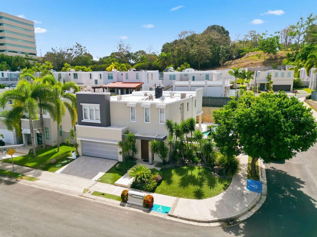 Beautifully remodeled and expanded corner residence located in the exclusive gated community of Los Árboles de Montehiedra. This spacious home has an upgraded and functional layout with generous living areas designed for both everyday comfort and entertaining.The property features a private swimming pool, covered terrace, and inviting outdoor spaces, creating the perfect setting for gatherings and relaxation. Additional highlights include a full-power generator and water cistern for added convenience and peace of mind.Ideally situated on a desirable corner lot within one of Montehiedra’s most sought-after communities, this move-in-ready residence combines space, privacy, modern upgrades, and an excellent location.