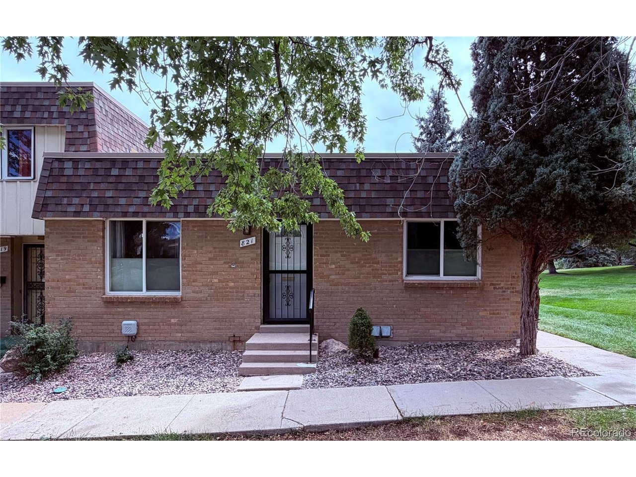 Welcome to your future home! This beautiful 3-bedroom, 2-bathroom townhome has the perfect layout for any lifestyle! A ranch style home is a rare find in this community and located in the highly desired Green Mountain area. Not only does this main level provide the convenience of one-level living, it's primary bedroom has it's own full private bathroom. Not getting your laundry done is no excuse here, as the laundry area is just a few steps away from each bedroom. Need to unwind after a day of nonsense? Well, you can do so on your own private patio. Want to sit down and enjoy your morning coffee? Well that nice patio is also fenced, so you can enjoy the sunrise in peace on that patio too. Enjoy the peaceful evenings this community provides before going out into the world again. If you've had enough of the summer heat and already dreading next summer, don't worry, the A/C was replaced September of 2026! Popcorn belongs to movie night, not the ceilings. It's been removed, so no popcorn ceilings here! The wood floors look great and the windows have been updated. The previous owners added wall insulation too. They kept up on annual furnace maintenance (which will be helpful if winter decides to ever get cold again). With neighboring trails, restaurants, and a quick drive to all major highways this townhome will give you access to go anywhere your heart desires. Unless you take the long way with any of these: Red Rocks Amphitheater, Golden, Downtown Denver, and the Broncos Stadium are all around 10 miles away. Belmar is under 4 miles away. St Anthony hospital is around 2 miles away, if you don't like that hospital, Intermountain Health Lutheran Hospital is around 6 miles away. The Colorado Mills is under 5 miles away. But the community pool house wins the race as it is only a small walk from the front door! You can book your private parties and celebrate all the birthdays whenever, it is opened year round.