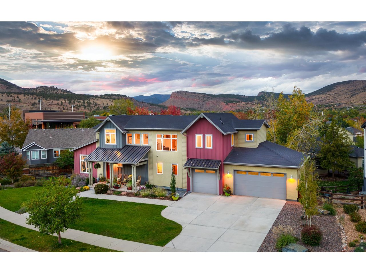 OPEN HOUSE SAT 10/17 - 11:00-2:00 PM. One of one. Designed for one of Lyons Valley Park's largest lots, this custom Markel home has a yard that deserves its own introduction. A generous front lawn, expansive side yard and large backyard surround the home, with mature trees, a play set and raised garden beds. Morning coffee may run long on the sunny south-facing front porch. So might dinner with friends on the private deck, with Steamboat Mountain in view. Views fill every window, and white oak floors warm the light, modern main level. The gourmet kitchen pairs soft gray and wood-grain cabinets with a generous island. There's room for everyone in the spacious living room, where a cozy gas fireplace makes fall evenings hard to beat. Even Monday mornings look good here, with the best kind of corner office: windows filled with sunshine, glass French doors and a commute measured in steps. Upstairs, the primary bedroom has a large picture window framing downtown Lyons and Steamboat Mountain, plus a generous walk-in closet. The five-piece bath feels like a private spa, with a vaulted ceiling and glass-enclosed shower. After a soak beneath the sunny south-facing window, it may become your favorite room in the house. Guest bedrooms, a loft and a spacious laundry room complete this level. The partially finished garden-level basement adds a fourth bedroom and bath, family or rec room, abundant storage and unfinished space ideal for private workouts. A mudroom with built-ins connects to the 3-car garage with EV charging. Come winter, you'll appreciate the south-facing driveway. Lyons offers its own brand of magic, with hometown holiday parades & a vibrant community. Everything is just a golf-cart ride away. Lyons Middle/Senior High School is around the corner. Walk to the river, explore trails and enjoy stunning parks, open-space recreation and the 10-acre dog park. Boulder & Longmont are an easy drive, and Rocky Mountain National Park is about 35 minutes up the hill.