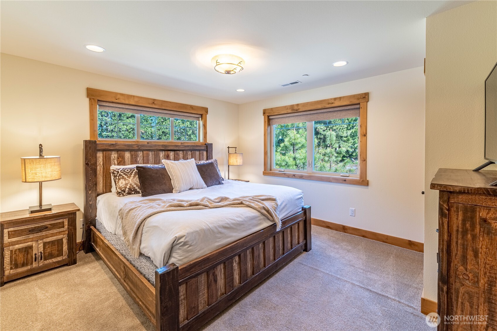 Bright and inviting third king bedroom filled with natural light.