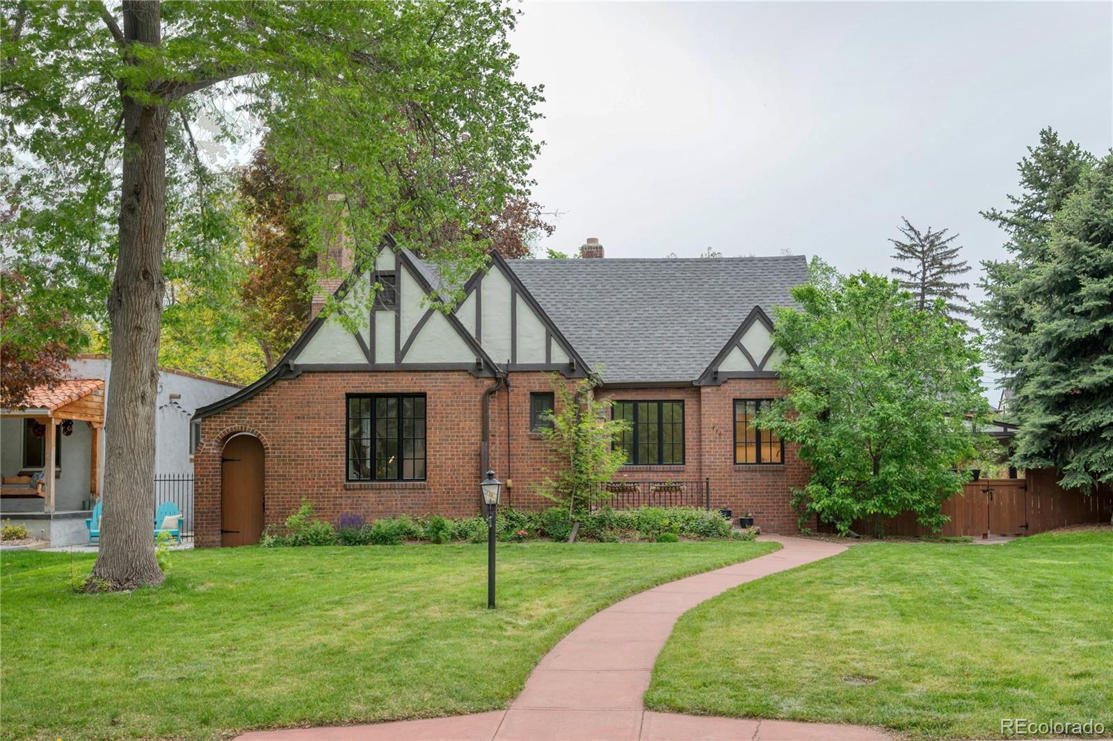 Welcome to 770 Locust St – a beautifully updated brick Tudor that effortlessly blends timeless character with modern comfort. Nestled on a tree-lined street, this home boasts an oversized yard, the largest on the market in this neighborhood in years. 

Step inside to discover an inviting open concept floor plan filled with natural light featuring four bedrooms and three bathrooms. The living room seamlessly flows through the dining area into the kitchen. 

Every inch of this house has been updated, including the addition of a primary en suite with soaking tub and walk-in closet. The hardwood floors have been refinished throughout the upstairs. The spacious basement is fully finished with new carpet, ample storage, and a second living room. The oversized backyard offers an oasis with mature landscaping and a 5-person hot tub.
The detached two-car garage is accessed via the alley with an automatic gate.

Located within walking distance to Crestmoor Park, Jersey St. Shopette, Montclair Park, and close proximity to 9Co+, Trader Joe's, and many more. Don’t miss the opportunity to own this gem with rare outdoor space in one of Denver’s most desirable neighborhoods.