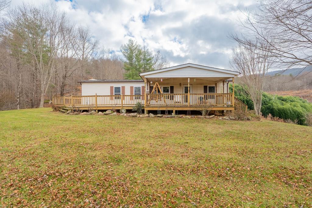 Experience the perfect blend of privacy, beauty, and functionality on this exceptional 40.92-acre property. This inviting 3-bed, 2-bath manufactured home features a covered front porch and a stunning wraparound deck overlooking breathtaking views in every direction. Enjoy a gorgeous pond, a balanced mix of open pasture and mature woodland, and plenty of usable acreage ideal for livestock or recreation. The property includes partial fencing, several barns {Some need some work}, and ample space for horses, cattle, or your dream hobby farm. Whether you're seeking a peaceful homestead, a working ranch, or a private retreat surrounded by nature, this rare unrestricted acreage offers endless possibilities. Serenity, scenery, and space—this one truly has it all.