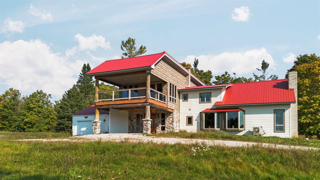 ''Shhh don't tell anyone''...This is what the locals on the east side of the Mitten are always saying about this truly wild and gorgeous area. Just 15 miles from Lake Huron,now is your chance to have that perfect ''up north'' seclusion, with clean air, the abundance of the natural landscape, and a gorgeous home to enjoy it in. This custom home was lovingly constructed by it's owners to reflect the beauty of the land right back to it's residence. Enjoy cooking in the chef's kitchen with premium finishes and appliances, or relax in the enormous spa bathroom off of the equally enormous primary suite. The stunning views from the upstairs porches look out on to your 8 acres of private land!When winter arrives, you will be comfortable in front of the gorgeous fireplace and huge windows. The sale includes not only the land, but the barns. No expense was spared on this home, and it's ready for it's next owner to enjoy it. BATVAI.