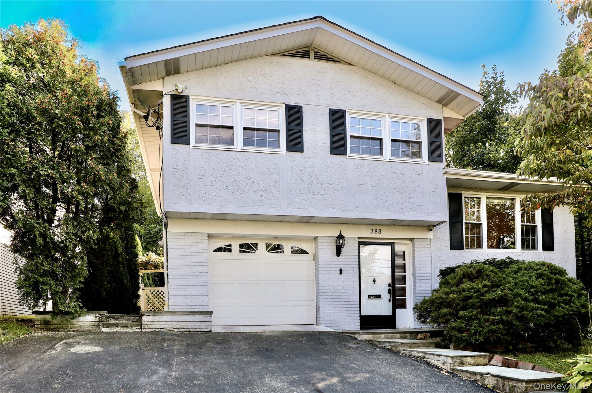A wonderful opportunity to move right into this beautiful 4 bedroom, 2 bath home perfectly located in Rye Brook within 1.2 miles to the train station. This home features a kitchen open to the living room, a stunning sunroom with cathedral ceilings, four bedrooms and two full bathrooms. Recent upgrades include a new 3 Zone Smart HVAC System, hot water heater, new appliances, new roof and has been freshly painted. The backyard is professionally landscaped and well kept. Enjoy this maintenance free home on a quiet street which is within walking distance to the schools, Crawford Park, numerous restaurants as well as public transportation, and easy access to Rye Brook shopping centers. Close proximity to Metro North, I-95, the Hutchinson Parkway, I-287 and just a short drive to Connecticut makes this home centrally located for all.  Pack your bags and move right into this all-inclusive home!