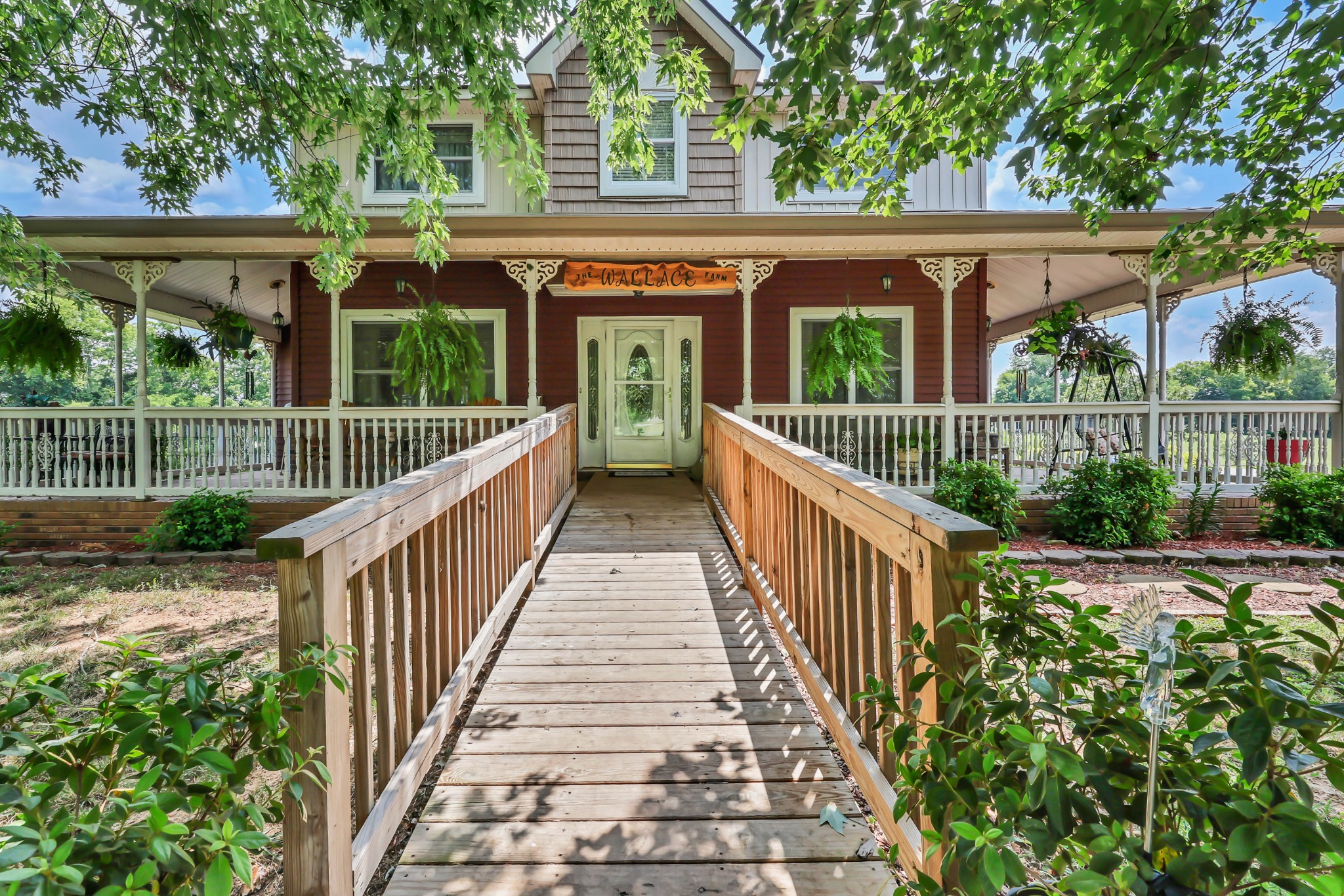 Tucked away on 5.6 private acres and completely hidden from the road, this exceptional mini farm offers peaceful country living and unbeatable convenience. Enjoy the best of both worlds with a prime location on the Nashville side of Clarksville in one of the area's top-rated school zones, offering an easy commute to Nashville, Fort Campbell, and I-24. Everyday conveniences are just minutes away, including Vanderbilt Emergency, the future Ascension Saint Thomas Hospital (expected Fall 2028), and an abundance of shopping, dining, and grocery options less than 10 minutes from your doorstep.This floor plan design features a spacious primary suite with ensuite bath, walk-in closet, home office, formal dining room, laundry room, living room with a cozy propane fireplace, and attached two-car garage all on the main level. Upstairs offers three generously sized bedrooms, including one private suite with its own full bath and walk-in closet, while the other two bedrooms share a Jack-and-Jill bathroom. The walk-out basement provides even more living space with a bedroom, full bath, and large bonus room, making it ideal for guests, multi-generational living, or recreation.Outside, approximately two acres are fenced for farm animals, creating the perfect hobby farm setup. Enjoy a large garden spot, mature shade trees, producing blackberry and blueberry bushes, apple and peach trees, a spacious 21x14 enclosed sunroom, a 21x20 deck, and additional decking surrounding the above-ground pool, perfect for entertaining or relaxing while taking in the peaceful surroundings.Major updates provide peace of mind, including HVAC units, roof, siding, and both water heaters all approximately three years old or newer. Additional improvements include new kitchen appliances in 2015 and updated flooring in the kitchen, office, bathrooms, and basement staircase. This is a rare opportunity to own a secluded, move-in-ready mini farm in one of Clarksville's most desirable locations.