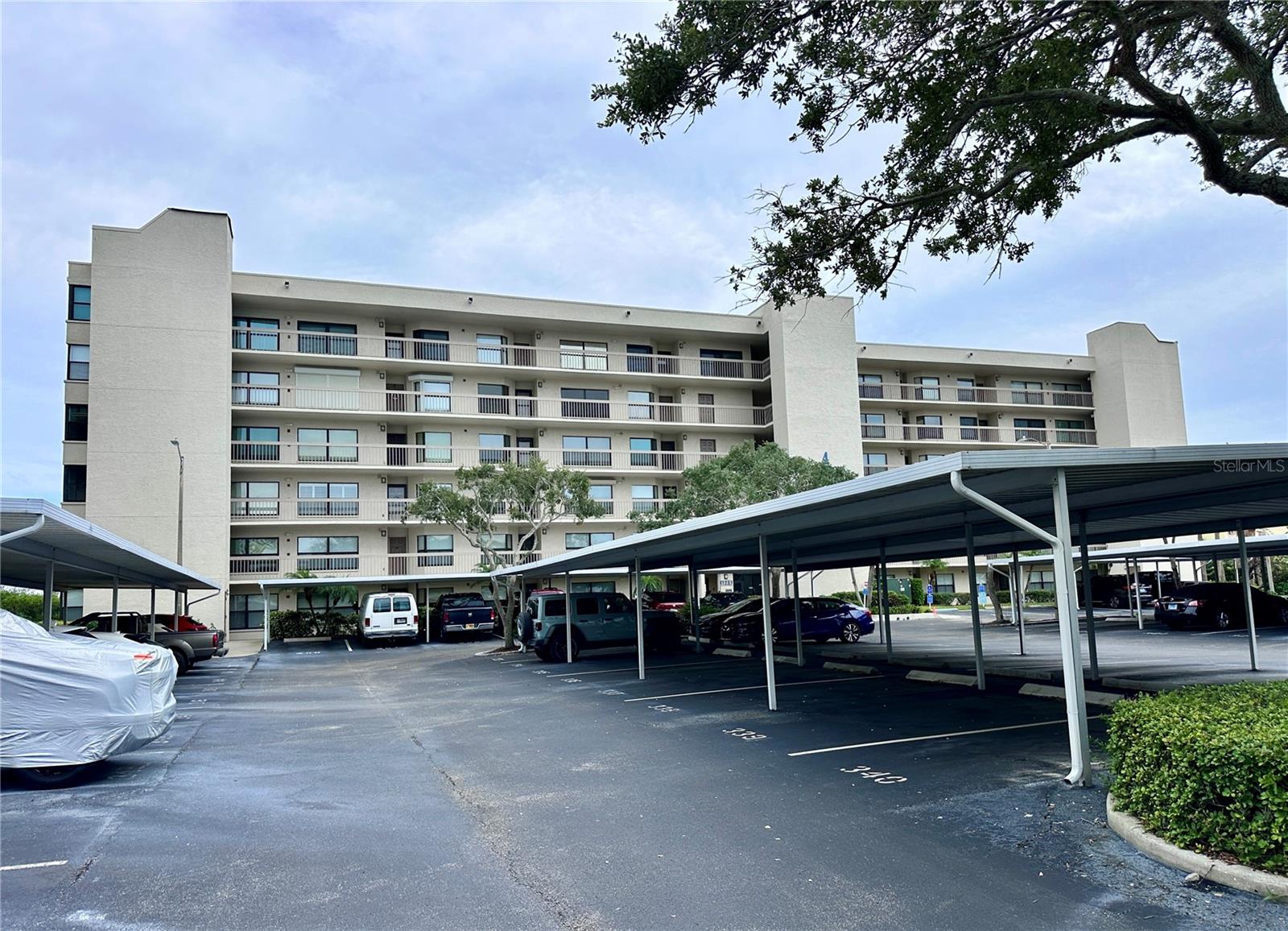 Gated, pet-friendly Pasadena Cove delivers true waterfront living on Boca Ciega Bay - minutes to St. Pete Beach and vibrant Downtown St. Petersburg. This 2BR/2BA split-plan home features a screened balcony with tranquil mangrove views, in-unit laundry, and a primary suite with walk-in closet and ensuite bath. Community perks include a heated pool & spa, clubhouse with fitness, kitchen, lounge & billiards, shuffleboard, scenic boardwalk, bike storage, personal storage unit, and assigned covered parking. Private marina with boat slips to lease or purchase (as available). Milestone Inspection/SIRS completed; no current special assessments. Monthly fee covers water/sewer/trash, cable & internet and common areas — buyer to verify. Close to shops, dining, medical, SunRunner transit, and TPA/PIE airports. Deeded covered parking 287 right in front of entrance door. Newer kitchen appliances. Water Heater 2021. HVAC 2018.