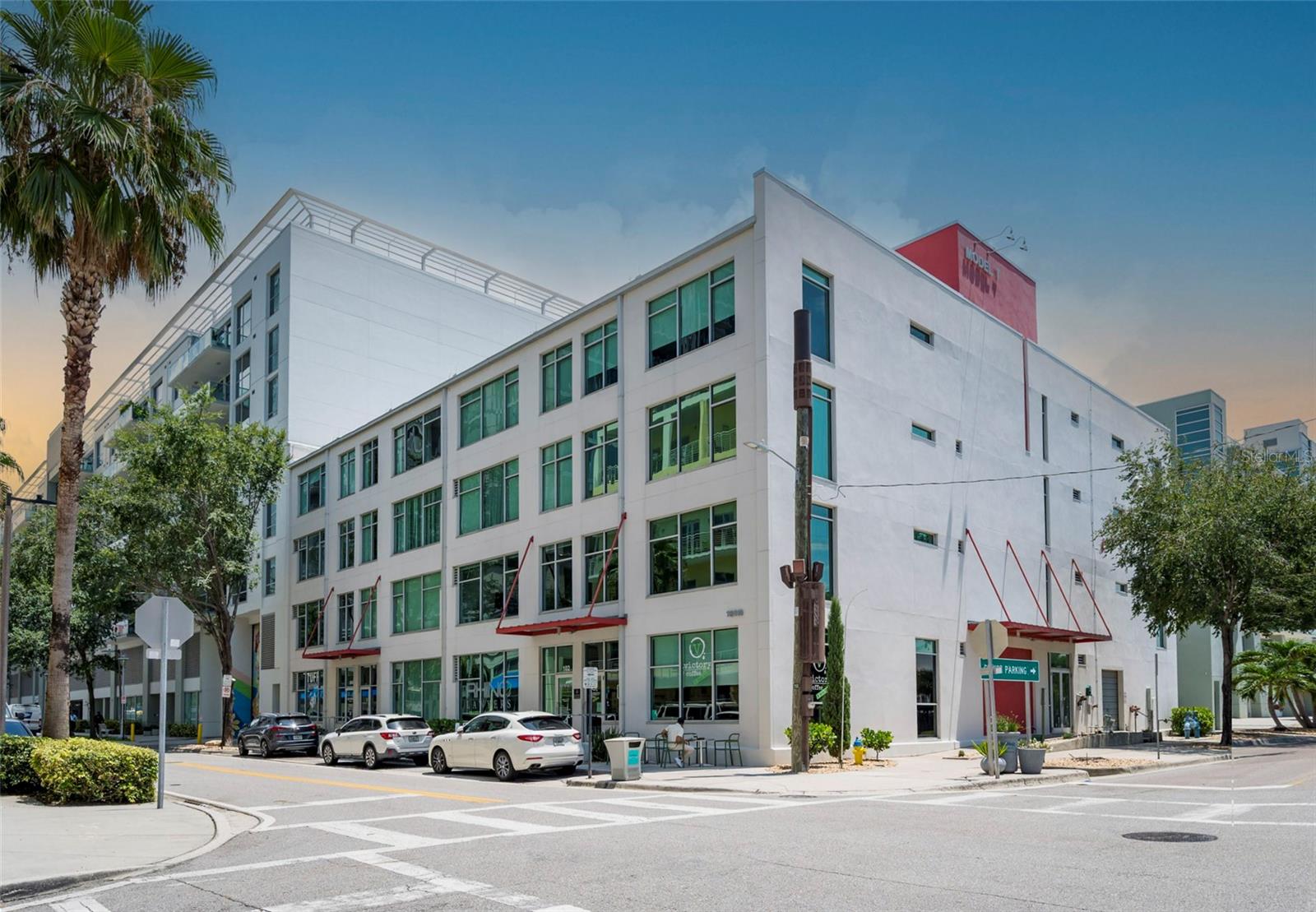 Tucked inside one of Tampa’s most unique and storied buildings, Unit 306 at Victory Lofts offers an authentic urban living experience in the heart of the Channel District. Originally built in the 1920s as an auto storage facility, the Model T Building has been thoughtfully converted into industrial-style lofts that reflect the area’s rich history while offering modern-day comfort.

This spacious one-bedroom, one-bath condo combines exposed concrete details, soaring ceilings, and expansive windows that fill the space with natural light. The kitchen is both functional and stylish, featuring granite countertops, a gas range, stainless steel appliances, a French door refrigerator, and a sleek tile backsplash. A custom barn door creates separation for the primary suite, full bathroom, and in-unit laundry closet.

Additional highlights include a new A/C system, a dedicated garage parking spot behind the building’s secure gated entrance, and a separate storage unit.

Victory Lofts residents enjoy a variety of community amenities including a rooftop deck with skyline views, a well-equipped fitness center, a dog run, a media lounge, and a renovated club room. The monthly HOA covers water, sewer, trash, gas, cable, and internet—making for a convenient and cost-efficient lifestyle. The building has also recently undergone a full roof replacement.

The location couldn’t be better—just blocks from Amalie Arena, Sparkman Wharf, Water Street, and the Riverwalk, with easy access to dining, coffee shops, and public transportation. Street parking permits are also available for residents on 12th Street.

Unit 306 offers a rare opportunity to own a piece of Tampa’s architectural past with all the advantages of modern downtown living. Easy to see anytime!