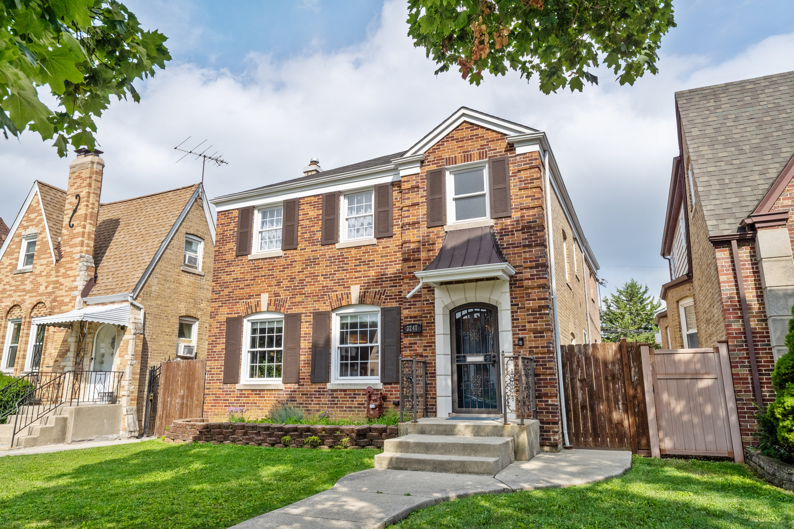 This four-bedroom, three-and-a-half-bath oversized Georgian home is a true gem. Situated on a serene, tree-lined street in the Dunning neighborhood, this home was completely renovated from the studs out.  The moment you arrive, its remarkable curb appeal, framed by mature oak trees, draws you in. Step inside to discover a fantastic, updated space with transitional finishes and modern, clean lines. The elegant dining room features a built-in hutch and plenty of space for a table of ten or more. The room flows seamlessly into a stunning kitchen, which boasts white shaker cabinets, quartz countertops with a waterfall edge, stainless steel appliances, and a beautiful Ann Sacks tile backsplash.  The back half of the main floor features an enormous living room with a cozy fireplace and leads out to the backyard and two-car garage.  Upstairs, the second-floor sleeping quarters offer four generous bedrooms, two full baths and laundry. The primary bathroom is a spa-like retreat straight out of a magazine, complete with double sinks, a massive soaking tub, and a large, separate shower. The finished lower level includes a third full bath and is currently used as a workout space, office, and media room. You'll find peace of mind knowing the home has been meticulously maintained, including a complete 2017 renovation that included new electric, plumbing, windows, roof, kitchen, baths, drainage tile, sump pump, ejector pump, and refinished hardwood floors. Recent improvements include a new wine fridge, chest freezer, water heater, furnace, AC, and humidifier, sump pump and battery. Welcome home!