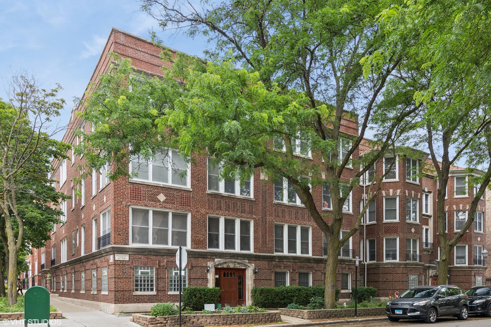 Welcome to this exceptionally bright top-floor corner home, perfectly situated on a quiet, tree-lined street just steps from all the excitement of Andersonville and Uptown. This thoughtfully designed residence offers a spacious and functional layout, featuring two generously sized bedrooms-rare for vintage buildings-alongside a large living room with fireplace and a charming dining nook. The kitchen boasts modern finishes, and a small private outdoor space just off the back door provides room for a grill and seating-ideal for morning coffee or evening relaxation. Enjoy the best of both worlds: a peaceful residential setting just a short walk from the CTA Red Line, downtown Andersonville, restaurants, shops, and nightlife. Bonus features include a huge private storage room and deeded parking-all included in the price. If natural light, smart upgrades, and unbeatable convenience top your list, this home is a must-see.