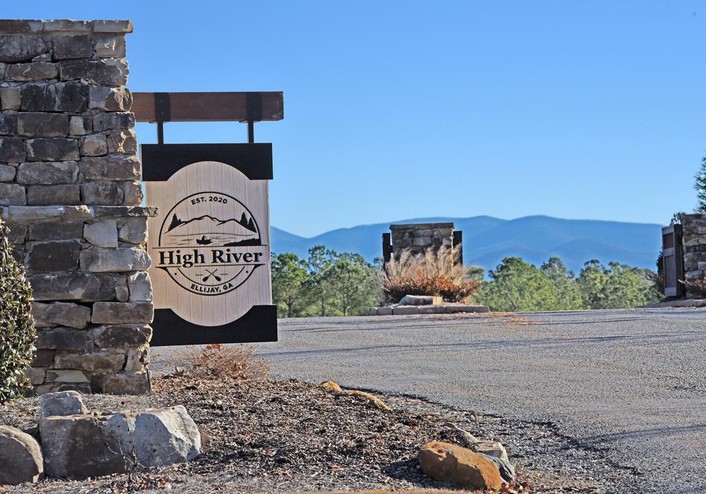 Discover the perfect blend of nature in a picturesque setting and modern conveniences with this expansive 4.34-acre lot in the prestigious gated community of High River nestled in the beautiful North Georgia Mountains! This lot offers year-round long-range views when you build your forever home and is truly a must see and unique opportunity! Enjoy exclusive access to the beautiful Coosawattee River and Mountaintown Creek parks along with a well-appointed clubhouse, riverside park, canoe launch, scenic hiking trails, biking and fishing.  Paved roads, underground utilities, high-speed internet and community water available.  Conveniently located close to Ellijay, Blue Ridge, Morganton and Mineral Bluff for shopping, dining, golf, wineries and more.  Come plan your dream home!  You won't be disappointed!