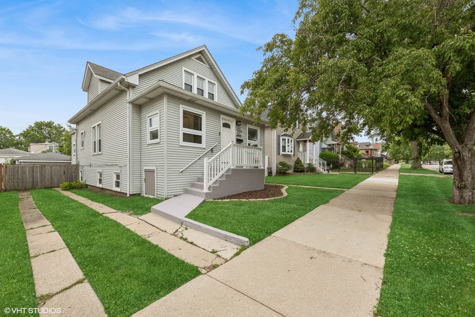 All the space you need-inside and out-on a peaceful, tree-lined street in the Portage Park neighborhood. This beautifully updated home offers three finished levels, 5 true bedrooms, 3 full baths, and stylish finishes throughout, all on an oversized 37'-wide lot. The heart of the home is the spacious eat-in kitchen, complete with quartz countertops, stainless steel appliances, a pantry closet and a large island with breakfast bar with seating for four. With nearly 9-foot ceilings on the main level and incredible natural light throughout both the first and second floors, the home feels open and bright. The kitchen is a favorite room in the house, thoughtfully updated in 2021 along with the bathrooms-including copper plumbing-and perfect for both daily living and entertaining. The open living and dining area flows beautifully for gatherings, while the expansive primary bedroom upstairs includes a walk-in closet large enough to be a room of its own. A full bath and an additional bedroom complete the top floor. The finished lower level, with brand new flooring (May 2023), offers flexible space for a rec room or guest suite. It includes a spacious bedroom, full bath, plenty of storage, and a laundry room. Out back, enjoy a lush, shaded yard with a built-out patio ideal for relaxing or entertaining. An oversized 2-car garage (plus attached storage shed), side driveway, and rear parking pad-room for up to 5 cars total, offers extra convenience for guests. The home also features a new copper water supply line (Nov 2023). Located in a fantastic pocket of Portage Park/Dunning, with a dog park, charming coffee shop just across the street, and nearby shopping at Brickyard Mall and Harlem-Irving Plaza (HIP). Bonus-  just a short distance to Chicago Academy Elementary & High Schools and St. Patrick High School.