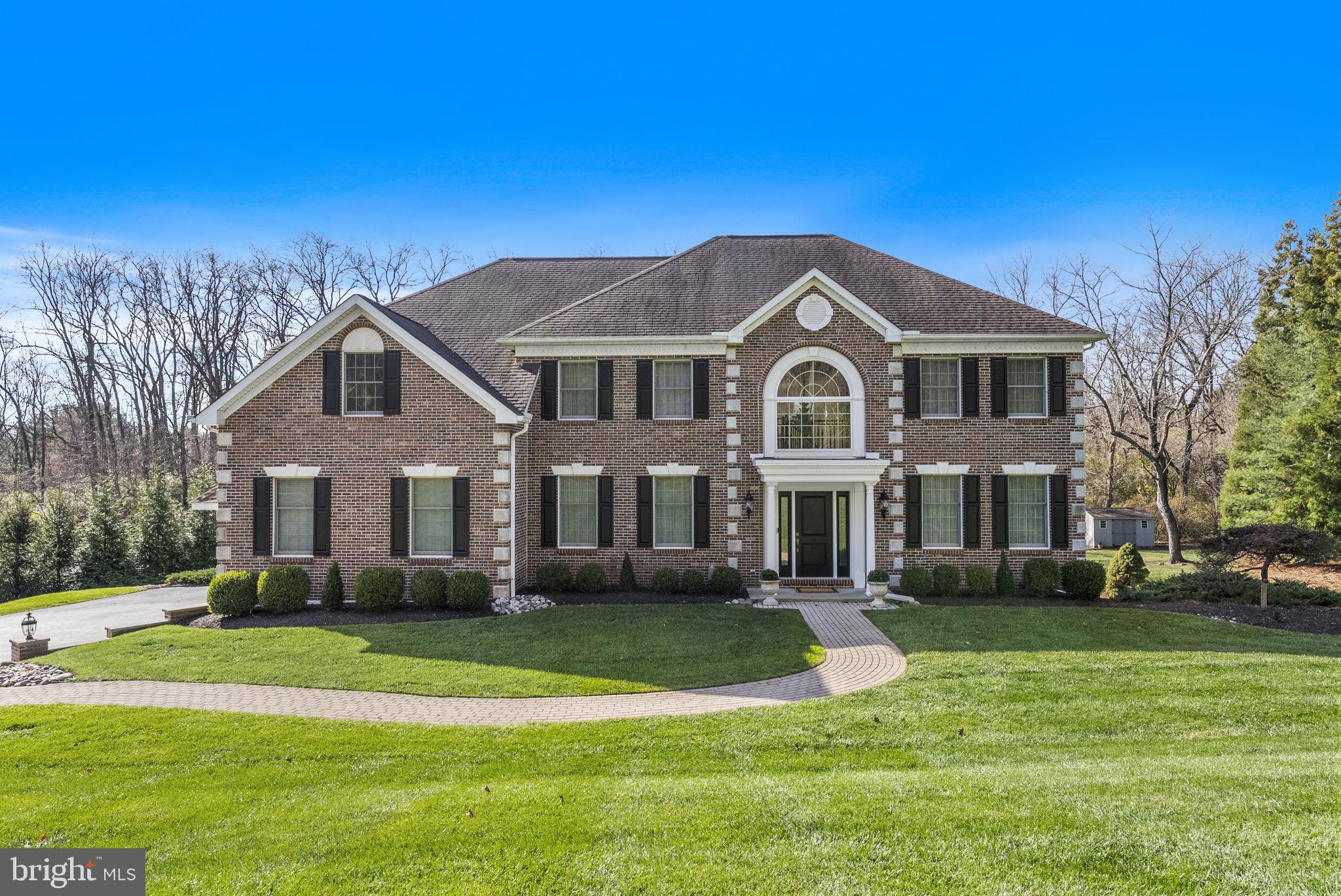 A Distinguished Brick Front Federal in The Moors at Radley Run. Set on approximately 1.8 acres in the prestigious Radley Run community and served by the award-winning West Chester Schools, this exquisite single-family residence offers over 4,100 square feet of refined living space on 1st & 2nd floors, plus an additional 1,600 square feet on the finished walk out lower level. Designed for those who value tradition, craftsmanship, and a warm, welcoming home, this property delivers on every front. Step inside to a gracious layout featuring a traditional living room, formal dining room, and a comfortable family room complete with a built-in bar for effortless entertaining. A private library provides the perfect spot for work or quiet moments, while the stunning, updated kitchen stands at the heart of the home with timeless style and thoughtful detail. The upper level features a true master retreat: a spacious bedroom, dual closets, a dedicated sitting room, and a brand-new marble bathroom that radiates elegance and careful design. Three additional bedrooms, all updated, share a beautifully finished hall bath with dual sinks and tasteful tilework. The lower level adds exceptional flexibility, offering a private bedroom and full bath, a bar area, gym room, and expansive open space ideal for gatherings, guests, or extended living. Outdoors, the property rolls into open green space backing to a serene stream and wooded landscape. Located in a desirable neighborhood, yet Tucked along a private drive of 3 homes, the setting offers peace, privacy, and the sense of home people spend years searching for. A rare opportunity in a highly coveted Chester County location where space, comfort, and traditional beauty come together with effortless grace. Low Taxes & easy access West Chester borough, roadways & shopping!