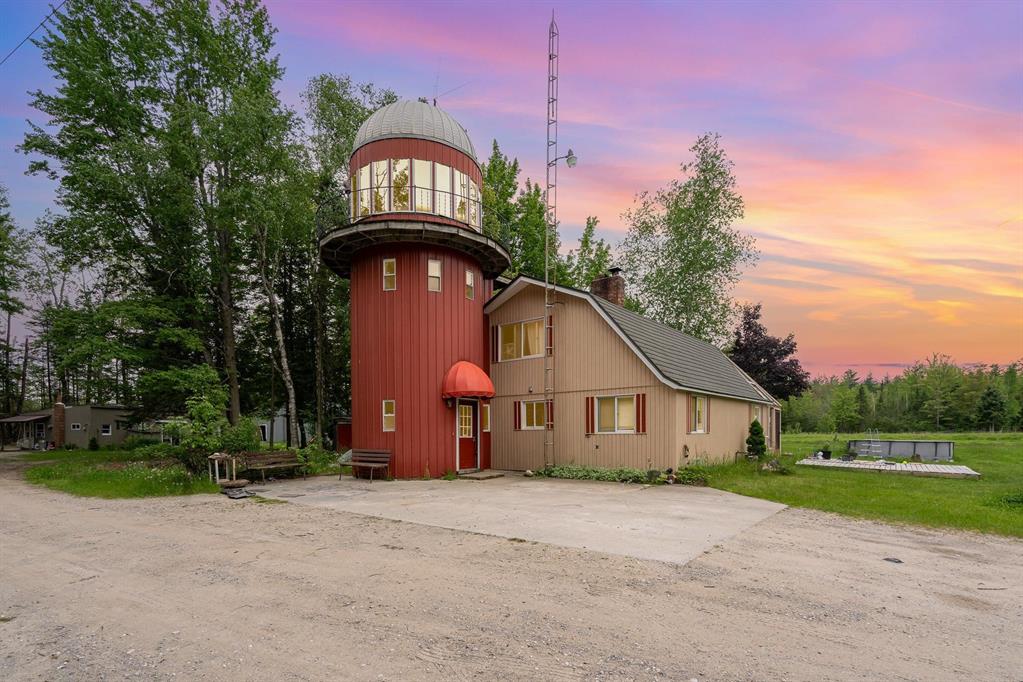 Welcome to this one-of-a-kind property on 39 private acres in Alpena! Featuring a converted barn home, a detached guest house, a horse barn, and a large pole barn with workshop. The main house integrates the original barn silo, now a unique two-level reading nook or sunroom. Walk in through the silo base into the laundry room, which flows into a spacious kitchen, dining area, and living room. Main level also includes a bedroom and full bath; upstairs offers a second bedroom, half bath, and open living space. Wood boiler is the primary heat source, with backup fuel oil system in place. The detached mother-in-law house includes a bedroom, full bath, kitchen, living room, and an additional room for office or second bedroom. Property is mostly wooded with a mix of cleared land and a front-yard pond, creating a peaceful, secluded setting. Horse barn offers stall potential and storage, while the pole barn includes concrete floors and a rear workshop. Additional lot available with Thunder Bay River access. Schedule your showing today to come see all that this property truly has to offer!