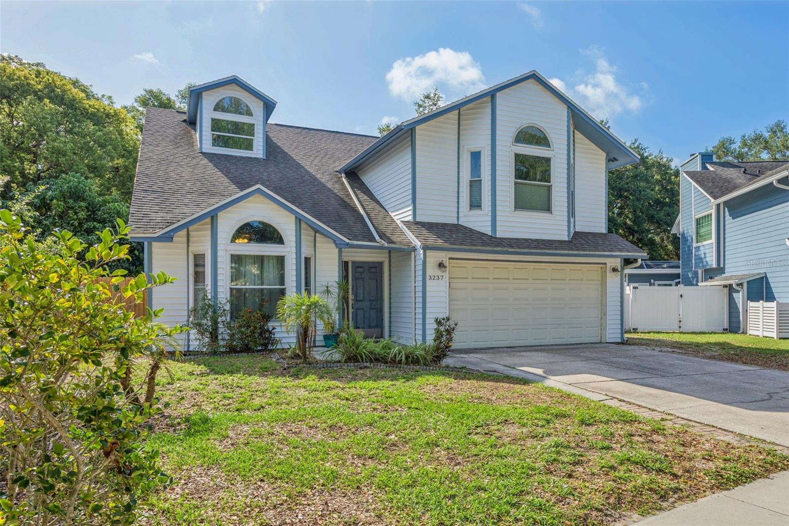 Get ready to move right in to this 4 bedroom, 2 ½ bath pool home with fireplace and two car garage. This house is located on a rare oversized and private lot in the Hamlet at Bentley Park. This home boosts New vinyl siding (2026) New AC system (2026) New Solar Panels (2024) New roof in 2020. The lot has plenty of room for any addition you have in mind and has beautiful mature trees ( plus a Mango tree ) with a fenced backyard, so you may enjoy hosting events in total privacy. This home is bright and airy with cathedral ceilings, skylight, wet bar, and a large eat-in kitchen and large pantry. The master bedroom has beautiful windows with a cozy window seat, and you can spend hours in your master bath with garden tub, shower, and dual sinks. The closet space is a dream with plenty of room for all your accessories.  The community is close to the local middle school and located in the desirable Palm Harbor University High School district. It is in a non evacuation zone and close to lake Tarpon.  Be prepared to enjoy an abundance of amenities in your new community including tennis courts, community park, community pool with hot tub/spa. This will not last long so call for your appointment now!