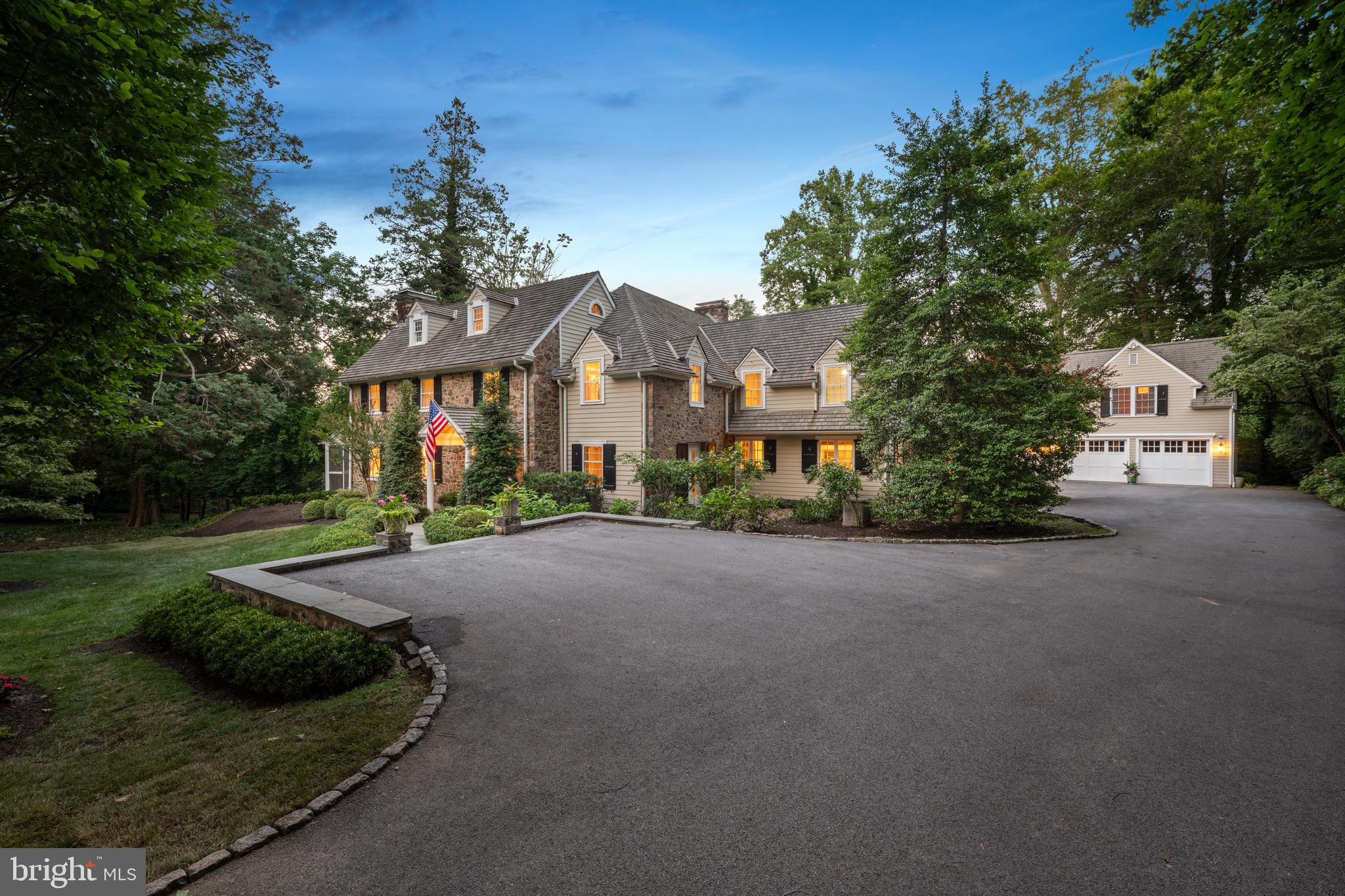 SOME HOMES SIMPLY HAVE A SOUL.....Quietly tucked among the winding lanes of the prestigious Ardrossan section of Villanova, the Gold Coast of Radnor Township, 847 Lesley Road has been gracefully welcoming family and friends for nearly a century. Offered for the first time in over 40 years, this extraordinary three-story stone Colonial is more than an architectural landmark—it is a home filled with laughter echoing from summer afternoons by the pool, holiday gatherings that spilled from one gracious room to the next, and generations of cherished memories waiting to be passed to those who will write its next chapter. From the moment you arrive beneath the canopy of mature trees, there is an unmistakable sense of peace. The house feels as though it has always belonged here, perfectly settled into its breathtaking surroundings where architecture and nature exist in complete harmony. Lovingly expanded and thoughtfully reimagined over the years, every addition has honored the home's timeless character while creating the effortless luxury today's lifestyle demands. Sunlight pours through oversized windows and French doors, illuminating beautifully proportioned rooms where refined millwork, gleaming hardwood floors, and timeless architectural details create spaces that are both elegant and wonderfully inviting. The main living spaces unfold with remarkable ease, each room flowing naturally into the next before opening through countless French doors to wraparound stone terraces, an expansive deck, and one of the most magical backyards on the Main Line. Here, lush gardens, sweeping lawns, towering specimen trees, and a sparkling pool create a private sanctuary that feels worlds away. It is easy to imagine children spending endless summer days in the pool, cocktails shared on the terrace as the sun begins to set, and family dinners lingering long into warm summer evenings beneath the glow of lantern light. Designed to evolve with every stage of life, the home offers five to six bedrooms, four full baths, and three half baths. A private office with its own entrance is tucked above the attached garage, creating an ideal work-from-home retreat. Completing this remarkable estate is a detached two-car garage with a beautifully appointed apartment above—perfect for extended family, an au pair, guests, or a private studio. Homes like this are extraordinarily rare. They cannot be recreated, only cherished. Rich in history yet thoughtfully refined for modern living, 847 Lesley Road offers that elusive feeling every buyer hopes to find—a home that is as beautiful as it is welcoming, as sophisticated as it is comfortable, and one that instantly feels as though it has always been yours. This is more than a home. It is a legacy. It is a lifestyle. It is where the next generation of unforgettable memories begins. SHOWINGS BEGIN ON WEDNESDAY JULY 15th!! Interior Photos coming & Square footage does not include apartment above 2 car detached Garage ( 1,279 sq ft)