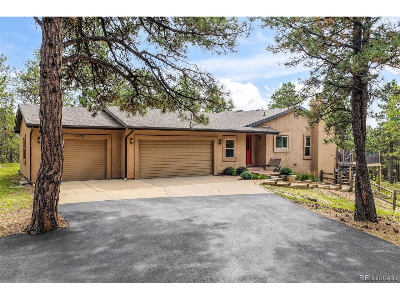 Discover Colorado acreage living on 3.71 treed acres in Monument's desirable Bent Tree community! Tucked at the end of a quiet cul-de-sac, this spacious 5-bedroom, 4-bath home combines privacy, Pikes Peak and mountain views, an oversized 3-car garage, and a full walkout basement in sought-after Lewis-Palmer School District 38. Mature trees surround the property, while an expansive paved driveway provides generous parking and access. Inside, hand-scraped wood floors lead to a beautifully remodeled kitchen with granite countertops, center island, soft-close cabinetry, stainless steel appliances, and Bosch induction cooktop and dishwasher. The open living and dining areas feature vaulted ceilings, abundant natural light, a wood-burning fireplace, and Pikes Peak views through newer double-pane windows. French doors open to a dedicated main-level office with deck access. The spacious primary suite also opens to the deck and features a walk-in closet, wood beam detail, and private 5-piece bath with dual sinks, jetted tub, and walk-in shower. Two additional bedrooms, full bath, half bath, mudroom, and main-level laundry complete the main floor. The walkout basement offers two additional bedrooms, a full bath, family room, recreation space, and extensive storage/workshop areas-ideal for guests, hobbies, fitness, entertaining, or flexible living. Enjoy composite decking, a covered patio, fenced backyard, mature trees, mountain scenery, and the privacy of acreage living. Served by a domestic well and septic system. Ideally located with easy access to I-25 and Highway 83, offering a convenient location between Colorado Springs and Denver with quick access to downtown Monument, shopping, restaurants, entertainment, and everyday conveniences.