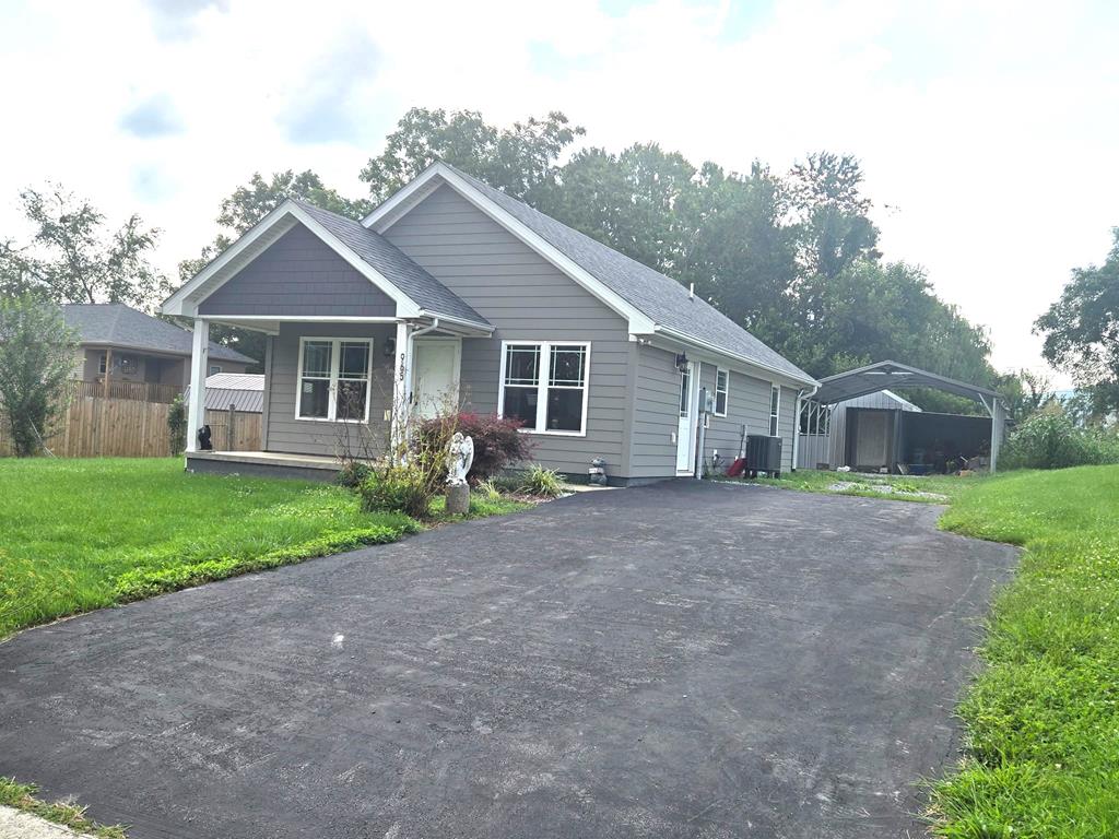 One level custom built home offering 1 BR and 1 Bath, large open living room on large level lot.  High-end finishes  including Hardi-Board siding including gas heat and tankless gas water heater.  Home has sunroom that could be converted into small bedroom. Property offers paved driveway, two car metal carport.