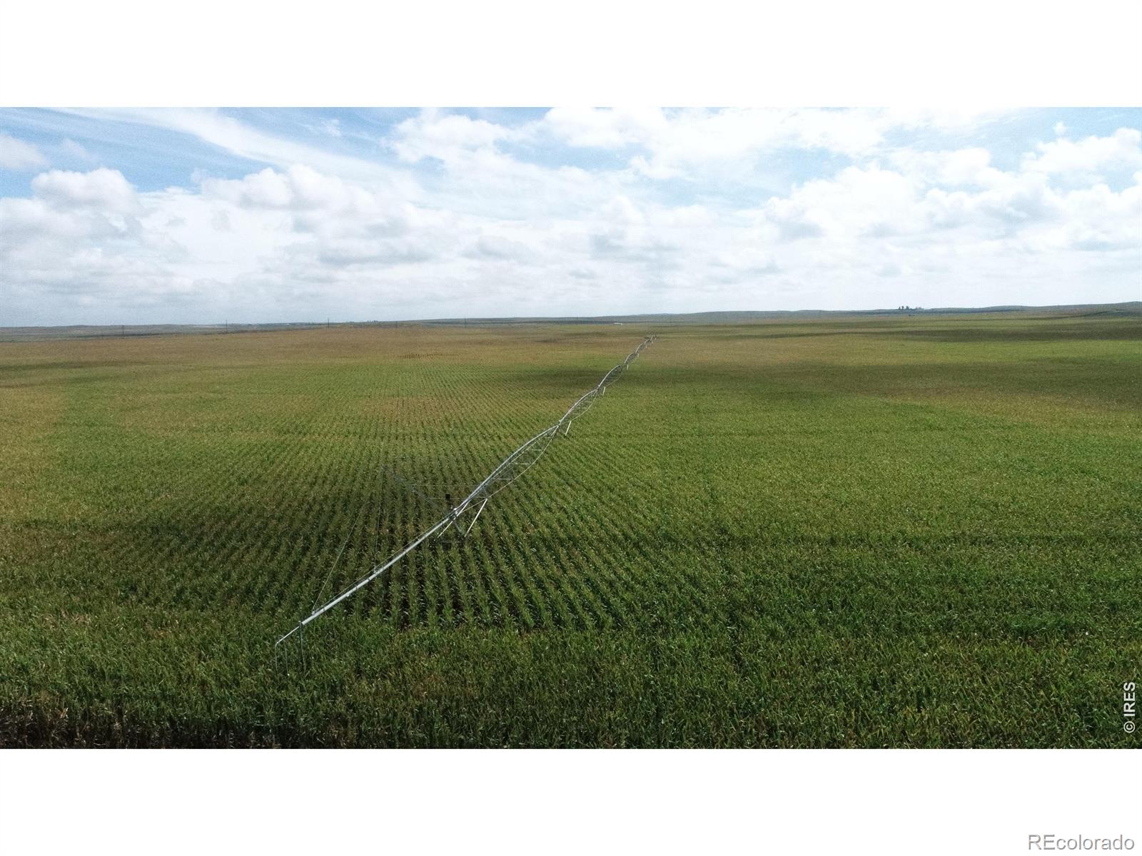 Exceptional irrigated farm and grazing opportunity located approximately 10 miles south of Yuma, Colorado. This 195.32-acre property includes 160.30 irrigated deeded acres and 35.02 acres of native sandhill pasture. The property features two center pivots, excellent highway access, established irrigation infrastructure, and a proven history of agricultural production.The 160.30 irrigated acres are serviced by a 4-tower pivot and an 8-tower pivot and one irrigation well. The pivots have consistently produced 200+ bushel corn and have benefited from extensive maintenance and upgrades, including a new irrigation motor, new fertilizer tank, AgSense Field Commander, Variable Frequency Drive, moisture probes, and a new pivot pad and dogleg on the smaller pivot.The remaining 35.02 deeded acres consist of native sandhill pasture. The entire property is enclosed with a four-wire perimeter fence, providing an excellent opportunity for grazing crop residue following harvest and adding flexibility for an existing agricultural operation.Conveniently located approximately 10 miles south of Yuma with excellent highway access, the property is well positioned near multiple agricultural markets. Several co-ops, feedlots, and dairies are located in the surrounding area, providing multiple outlets for corn, millet, hay, and other agricultural commodities.This property offers an opportunity to add productive irrigated acreage to an existing operation or acquire an agricultural investment with established local farm tenant demand. The combination of irrigated production, upgraded infrastructure, native pasture, fencing, and convenient market access makes this a versatile agricultural property in the Yuma area.Acreage, irrigation information, production history, water rights, and other property information should be independently verified by the buyer and buyer's agent.
