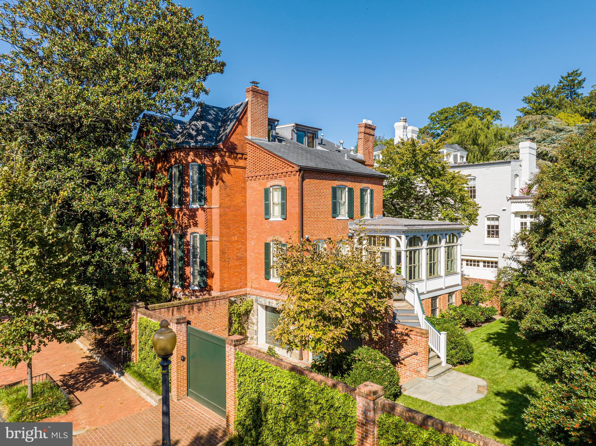 Sited on a charming and large 0.14-acre corner lot in Georgetown, 1601 28th St NW presents a masterfully crafted, stately Victorian, offering a seamless blend of comfort and ageless sophistication. Originally built circa 1880 along with two other homes within the historic Evermay Estate, the residence boasts 5 Bedrooms, 5 Full Bathrooms, and 1 Half Bathroom across 4 Levels and approximately 6,100 total square feet. The Main Level impresses with soaring 10'9” ceilings and features an inviting Foyer leading to spacious formal Living and Dining Rooms, ideal for entertaining. The Gourmet Kitchen features a Butler’s Pantry, Breakfast Area, and seamlessly flows into a connecting Family Room, with easy access to the rear Deck and flat rear garden, perfect for indoor/outdoor entertaining. The Upper Level is adorned with 10’ ceilings, and features 2 Bedroom Suites, to include the luxurious Primary Suite with a large walk-in closet, a Laundry Room, Office, and Sitting Room, providing endless comfort and functionality. The Third Level is home to two additional Bedroom Suites and ample Attic and Utility space. The multifunctional Lower Level is a versatile retreat, with an In-Law Suite/5th Bedroom Suite, a Kitchenette, as well as a Laundry/Utility/Storage Room. Direct access to the 2-car Garage, Gated Motor Court, and rear garden provides convenience and ease of living. Located in one of Washington, D.C.'s most desirable neighborhoods, 1601 28th St NW, offers a rare combination of privacy, luxury, and proximity to all Georgetown has to offer. Zoned for Hyde-Addison ES, Hardy MS, and Wilson HS. The property is close to Montrose Park, Dumbarton Oaks, Georgetown Library, and all of the shops and restaurants along Wisconsin and M Streets.