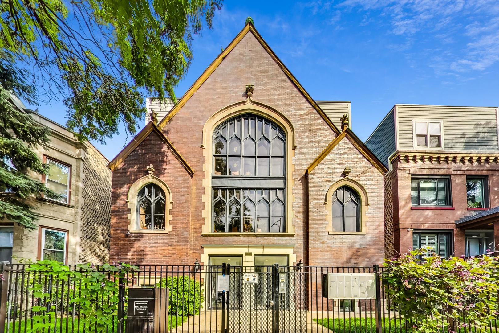 Rare Opportunity in Logan Square's Coveted Church Conversion. Tired of boring condos with no character? Don't miss your chance to own this stunning 2-bed, 2 bath condo located just three feet below grade, offering soaring 12' vaulted ceilings and high-end finishes. This unique home combines modern elegance with historic charm in one of Logan Square's most iconic church conversions.    Enjoy an open-concept layout with rich hardwood floors throughout, a chef's kitchen featuring custom cabinetry, quartz countertops, and a sleek tile backsplash, and a spacious living and dining area perfect for entertaining. The primary suite impresses with a spa-like bath including a frameless glass shower with a rain showerhead, double vanity, and designer finishes.    Additional highlights include in-unit laundry, generous closet space, and an included exterior parking space.    Unbeatable location just a half block from the 606 Trail, under two blocks to Armitage's acclaimed "Restaurant Row," minutes to Humboldt Park, and surrounded by a vibrant mix of historic and contemporary architecture.