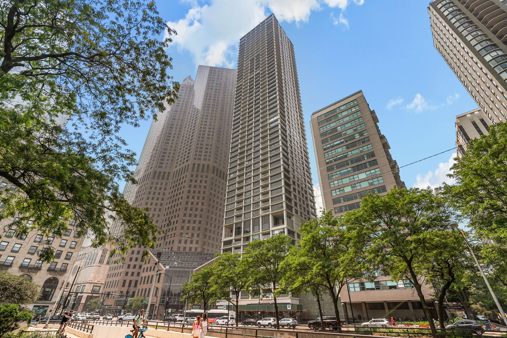 Experience breathtaking lake and city views from this preferred 3 bedroom, 2-bath home in one of Chicago's premier Gold Coast addresses. Expansive windows flood the living and dining spaces with natural light, while a covered east-facing balcony offers the perfect spot for morning coffee or evening entertaining. The one of a kind, custom kitchen features handcrafted cabinetry, a Wolf induction cooktop, Sub-Zero, Miele and Asko appliances, a walk-in pantry - ideal for the home chef. Butler's pantry with two built in Sub-Zero refrigeration drawers and dual beverage refrigerators just off the kitchen. The spacious primary suite boasts stunning lake views, a spa-like bath with a Robern vanity mirror and newly designed open-door closets. Convenient home office nook with built in desk, drawer & shelving is tucked away in the hallway just off the living room. A bonus cedar-lined walk-in closet in the unit and additional same-floor storage offer exceptional organization. Hardwood floors run throughout, complemented by motorized shades in the main living areas, in-unit laundry, and valet parking. Building amenities elevate daily living, including 24-hour door staff, valet parking, and an incredible 55th-floor amenity level with an indoor pool, state of the art fitness center, and banquet room with sweeping panoramic views. Residents also enjoy a 10th-floor library and lounge with a full kitchen, plus a beautifully landscaped sun deck with two fire pits, cabanas, and plenty of space to unwind. Located steps from world-class dining, shopping, and lakefront trails, this pet-friendly residence delivers the ultimate Gold Coast lifestyle, move right in and enjoy your urban oasis!