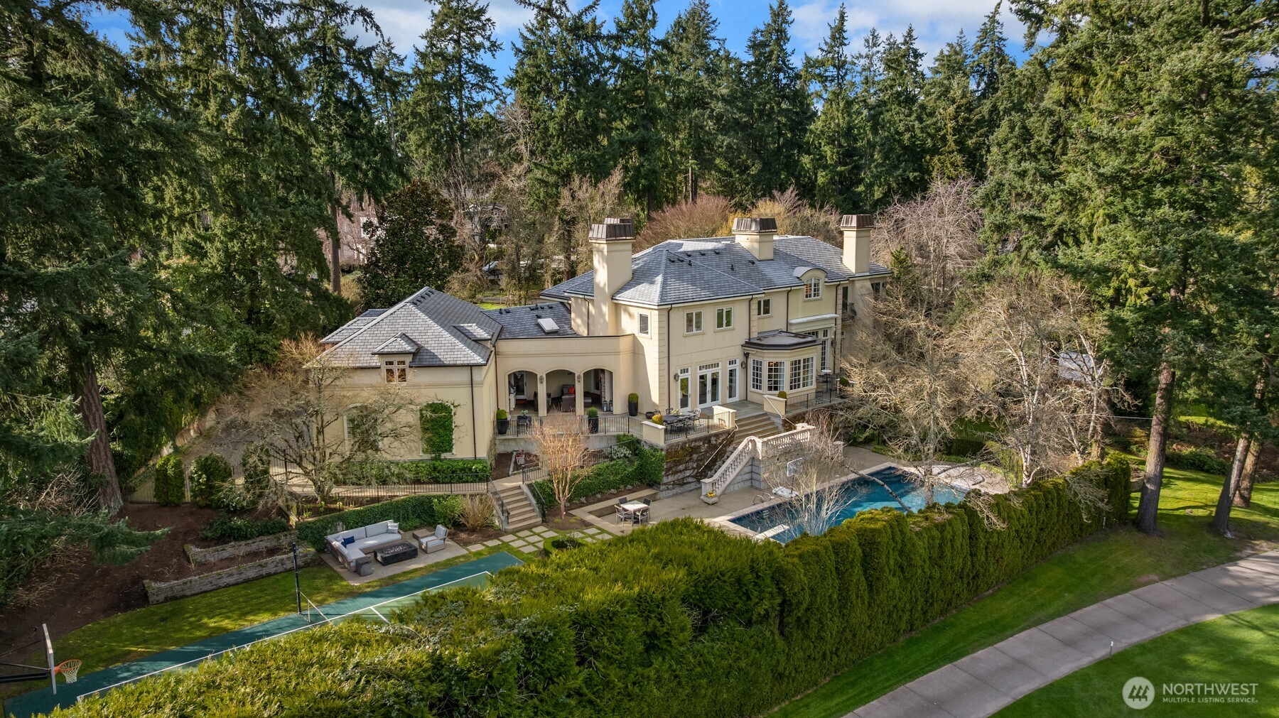 Tucked along the fairways in a secure, gated setting, the residence is surrounded by manicured grounds and a curated collection of distinguished estates.