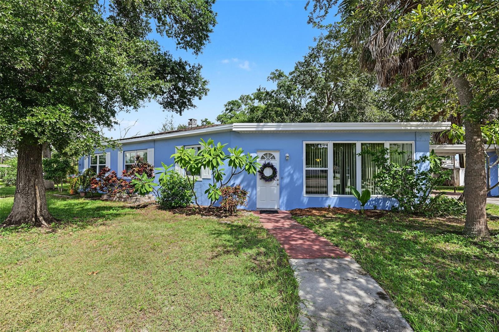 Opportunity awaits in the heart of Northeast St. Petersburg! Situated on a corner lot just minutes from vibrant Downtown St. Pete, this 3 bedroom, 2 bathroom single family home is full of character and ready for its next chapter. Whether you're looking for a home you can renovate and make your own or an investment opportunity in an incredible St. Pete location, this property offers plenty of potential for the buyer with the right vision. Inside, you'll find a distinctive floor plan with flexible living spaces, classic terrazzo flooring, and a third bedroom that lends itself perfectly to a home office, den, or flex space. While the kitchen and bathrooms are ready for updating, one major improvement has already been taken care of with impact rated hurricane windows installed throughout the home. Additional features include a carport, covered front patio, dedicated laundry area, multiple mini split and window A/C units, and a backyard offering additional outdoor space. With its prime location near Downtown St. Pete, shopping, dining, parks, waterfront destinations, and everything that makes St. Pete such a desirable place to call home, this is an opportunity to bring your ideas, add your personal touch, and unlock the potential of a truly unique property. Don't wait on this one as it won't last long!
