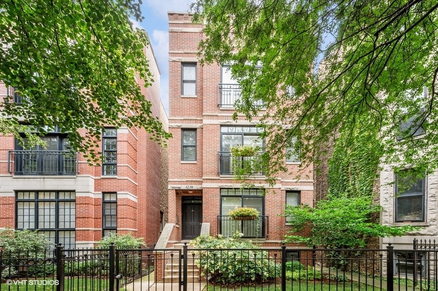 Discover this sun-drenched, all-brick penthouse condo offering unparalleled outdoor living in a coveted Lakeview location. Enjoy exclusive access to a newer constructed 1,300 sq ft private roof deck-perfect for entertaining with built-in lighting, gas and water hookups, and outdoor TV setup. Inside, the open-concept kitchen, living, and dining area features stainless steel appliances that vent outside, a breakfast bar, and a gas-starting wood-burning fireplace. A Juliette balcony provides serene treetop views, while hardwood floors and wooden blinds add elegance throughout. The spacious primary suite includes a marble bath with dual sinks, a separate tub and shower, and excellent closet space. The second bedroom and full guest bath offer flexibility for guests or a home office. Additional highlights include a large back deck accessed from the hallway, a private 6x6 storage room, and one garage parking space-all included in the price. Located on a wide, tree-lined street just blocks from the Belmont El stop and top-rated Nettelhorst School. This is a rare opportunity to own a turnkey penthouse with exceptional outdoor space in one of Chicago's most desirable neighborhoods. Currently tenant occupied until October.
