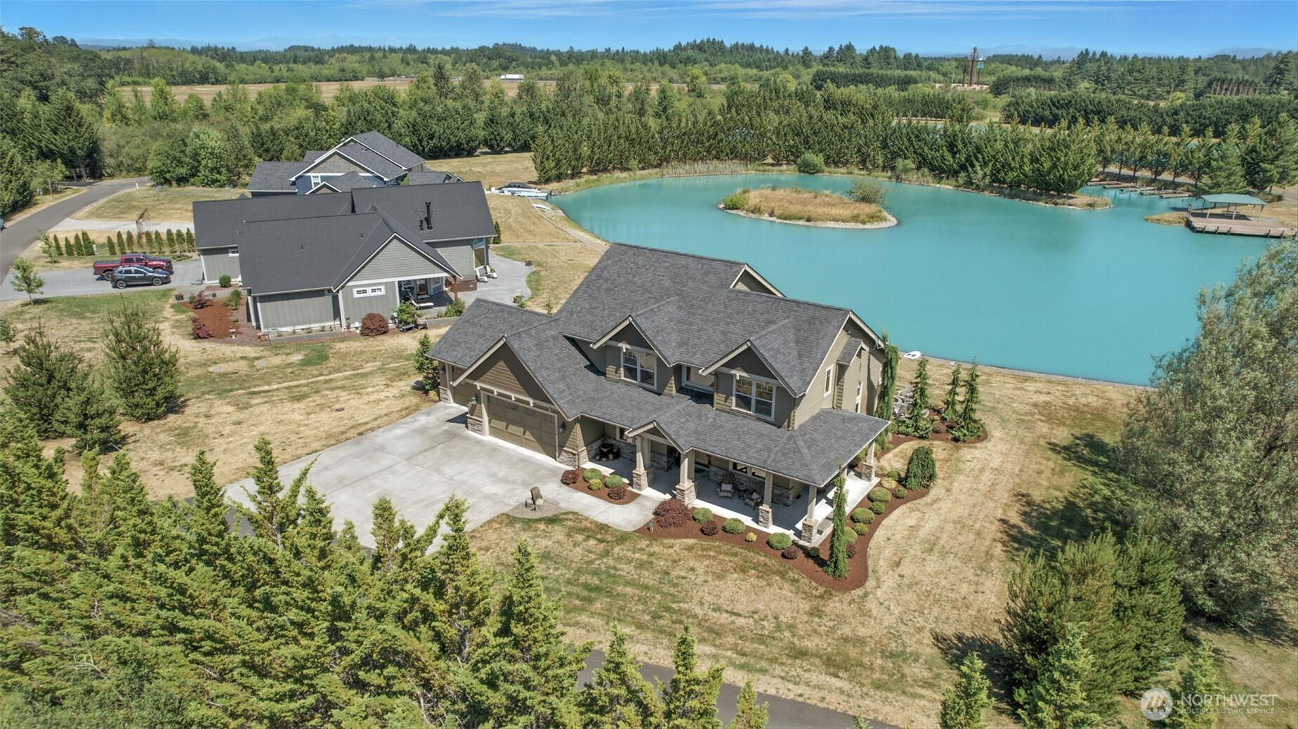 Enjoy exclusive access to your private lake, with access to a 2nd tournament waterski lake. This beautiful home includes a den and a spacious bonus room and includes a full bathroom on the main. Interior features include LVP flooring,11-foot ceilings, alder doors and cabinetry, quartz countertops, & SS appliances. The utility room offers a utility sink, folding counter, and ample storage.The vaulted primary suite includes a W/I closet with custom organizers. Additional amenities include a 3-car garage with 400-amp service, heat pump, hot tub, irrigation, fire pit, and covered patio with built-in heaters. Nestled next to 100 acres of timberland with direct access to trails. Gated Community. This isn't just a home, it's a lifestyle!