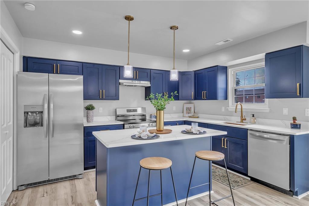 Welcome to this sun-drenched, newly renovated, end-unit townhouse! Featuring three bedrooms and one and a half baths, with modern upgrades throughout. Enjoy new carpet, luxurious LVP flooring, and stunning accents. The kitchen features an island, designer cabinetry and stainless steel appliances. Recent updates include a new water heater and HVAC system, both replaced in 2024. Located conveniently close to the oceanfront, this townhouse offers the perfect blend of comfort and convenience. Don’t miss out on this gem!
