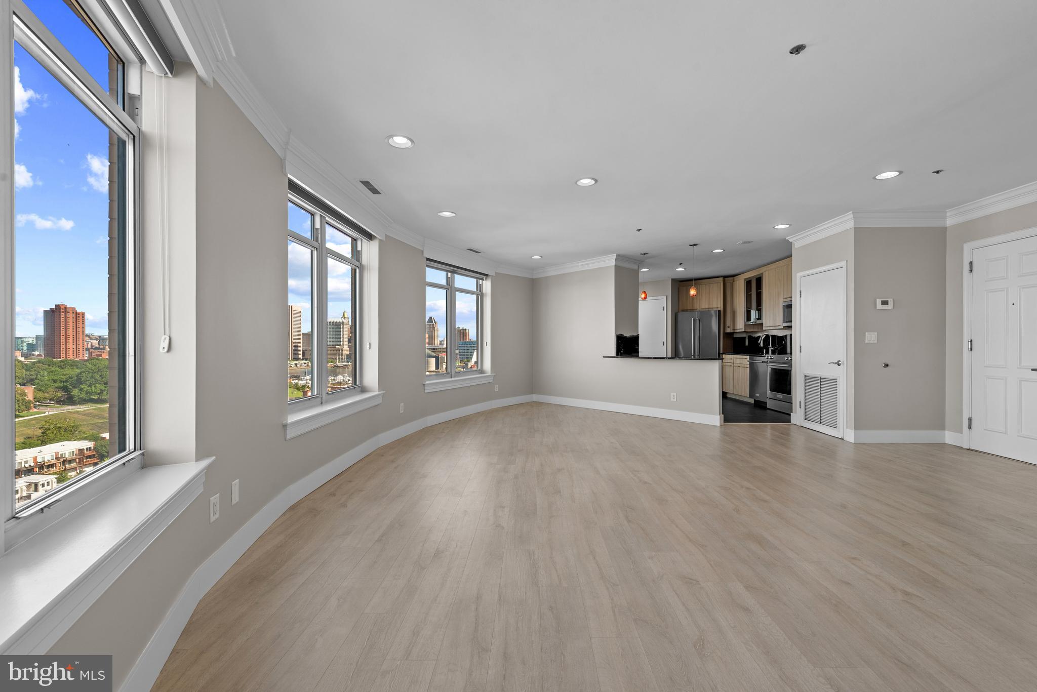 BACK ON MARKET!   SELLER WILL REVIEW ALL OFFERS ON MONDAY, OCTOBER 12TH, OR, CONTRACT WITH ACCEPTABLE FULL PRICE OR HIGHER OFFERS PRIOR TO OCTOBER 12TH.  ALL WRITTEN OFFERS CONSIDERED. SELLER FINANCING CONSIDERED!SPECTACULAR VIEWS!!  GREAT VALUE!! 16th-Floor  HARBORVIEW RESIDENCE WITH THREE PRIVATE BALCONIES!!Experience sweeping views and exceptional indoor-outdoor living from this beautifully renovated 2-bedroom, 2-bath residence at Harborview Towers. Offering approximately 1,644 square feet of living space and three private balconies, this 16th-floor home enjoys expansive west-facing views of the Baltimore skyline, harbor and stadiums—with spectacular sunsets providing a dramatic backdrop.The spacious, light-filled living and dining areas are designed for both comfortable everyday living and entertaining, with large windows and direct access to the balconies bringing the views into the home. The renovated interior offers a sophisticated, move-in-ready setting with a well-appointed kitchen, generous bedrooms and two full baths.The primary suite provides excellent space and privacy, while the second bedroom offers flexibility for guests, a home office or both. Three separate balconies create multiple outdoor spaces for morning coffee, evening cocktails or simply enjoying the changing skyline from high above the city.Parking is included, adding valuable convenience to waterfront city living.Harborview offers a distinctive waterfront lifestyle with easy access to the Inner Harbor, Federal Hill, restaurants, entertainment, sporting venues and major commuter routes.What truly distinguishes Unit 1610 is the combination of its 16th-floor elevation, three balconies, generous 1,644-square-foot floor plan, renovated condition and panoramic west-facing views. Come experience the sunsets—and see why this residence is so much more than a typical two-bedroom condominium.