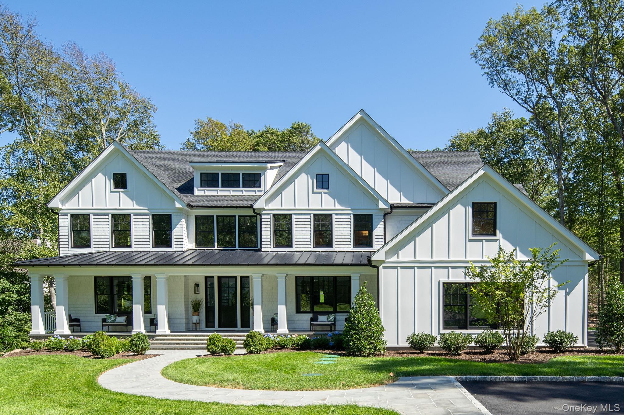 Welcome Home! Set in the heart of prime Cold Spring Harbor, this brand-new, custom residence offers 6,500 sq. ft. of modern luxury on 2 beautifully landscaped acres. Exceptionally designed with today’s lifestyle in mind, the home features 6 bedrooms, 6.5 baths, and stunning architectural details throughout.
The primary suite is a true retreat with dual walk-in closets and a spa-inspired bath complete with radiant heated marble floors, soaking tub, and custom shower. The chef’s kitchen stands out with Thermador stainless steel appliances, a quartz center island, and a butler’s pantry with wine cooler. The open floor plan flows seamlessly into the great room —perfect for both everyday living and entertaining. The wide-plank white oak floors run throughout the home elevating each space and bringing together the sophisticated details of this home. A first-floor bedroom with full bath and direct access to the yard adds additional flexibility. 
The expansive finished lower is designed for recreation and wellness with space for a home theater, gym and entertaining. Smart home wiring, a whole-house generator, and 3-car garage with EV charger hookup add to all the modern conveniences this home has to offer. Outdoors, the property is enhanced with bluestone walkways, Belgium block curbing, in-ground sprinklers, and lush landscaping.
Just minutes from Huntington Village, Cold Spring Harbor shops and dining, the train, and top-rated schools, this home delivers both luxury and lifestyle in one of Long Island’s most coveted communities. Cold Spring Harbor School District #2. Eagle Dock Beach and Mooring (dues).