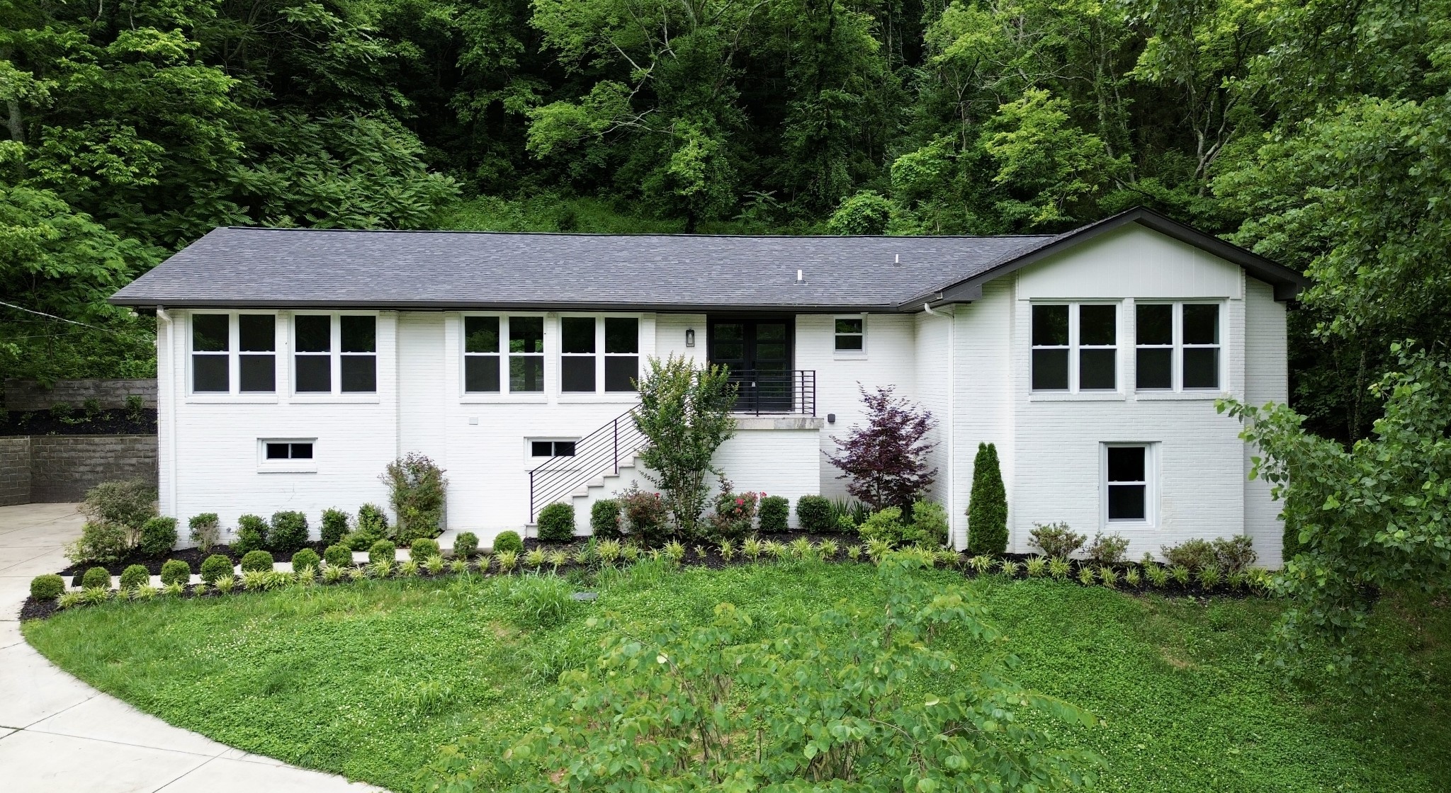 This beautifully renovated 3-bedroom, 3-bath home—featuring a versatile 4th office/bedroom in the finished basement—offers the perfect combination of modern luxury and tranquil privacy, set on a picturesque 1.6-acre wooded lot. Located just 25 minutes from downtown Nashville and a short drive from the vibrant Cool Springs Galleria, this home provides easy access to both city amenities and serene suburban living. Inside, the home features a thoughtfully designed open layout with brand-new appliances and an HVAC system that’s less than 3 years old, ensuring comfort and efficiency for years to come. The spacious finished basement adds valuable living space, perfect for an in-law suite, media room, or home office. The 2-car garage provides ample storage and convenience. Home is zoned for Williamson County Schools nearby. If you're looking for a peaceful retreat with modern finishes in an unbeatable location, this is the home you've been waiting for.