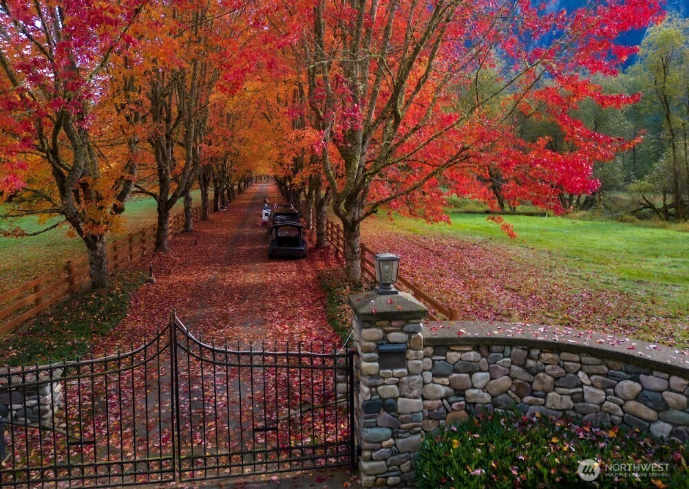 A truly unique, custom-crafted Canadian Red Cedar log home nestled on a breathtaking 36 acres of land with 800 feet of pristine riverfront. Panoramic views can be enjoyed from nearly every room. The grand entry welcomes you into an exceptional interior featuring travertine flooring and soaring ceilings. A generous kitchen offers a large island and plenty of space for gathering. Elegant marble and river-rock fireplaces add character and charm. The primary suite includes an expansive ensuite and a luxurious dressing room. Enjoy year-round swimming in the indoor pool. A gated entrance ensures privacy, making this property ideal as a private multi-home estate, event venue, or retreat destination. 4 Separate ADU units with full kitchens and bathrooms, currently used for Air B&B